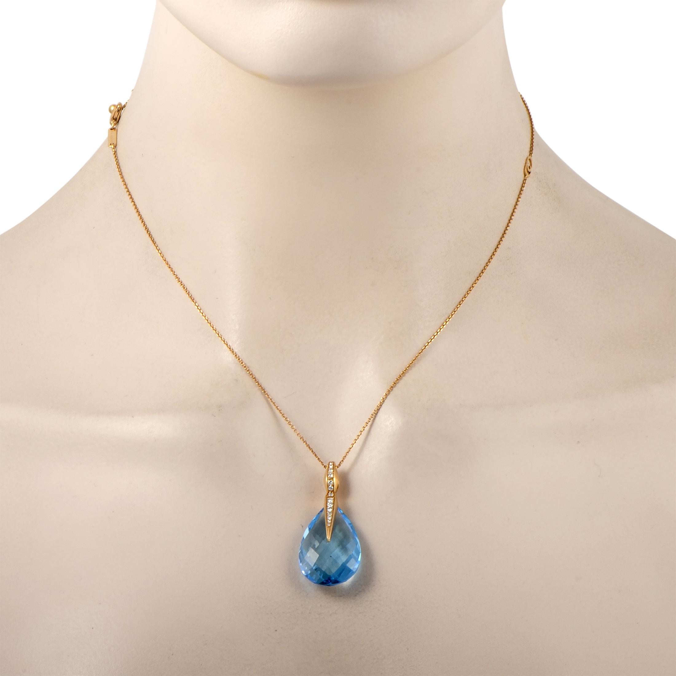 This Chimento necklace is crafted from 18K yellow gold and decorated with a topaz and a total of 0.18 carats of diamonds. The necklace weighs 9.9 grams and is presented with a 16” chain, boasting a pendant that measures 1.50” in length and 0.50” in