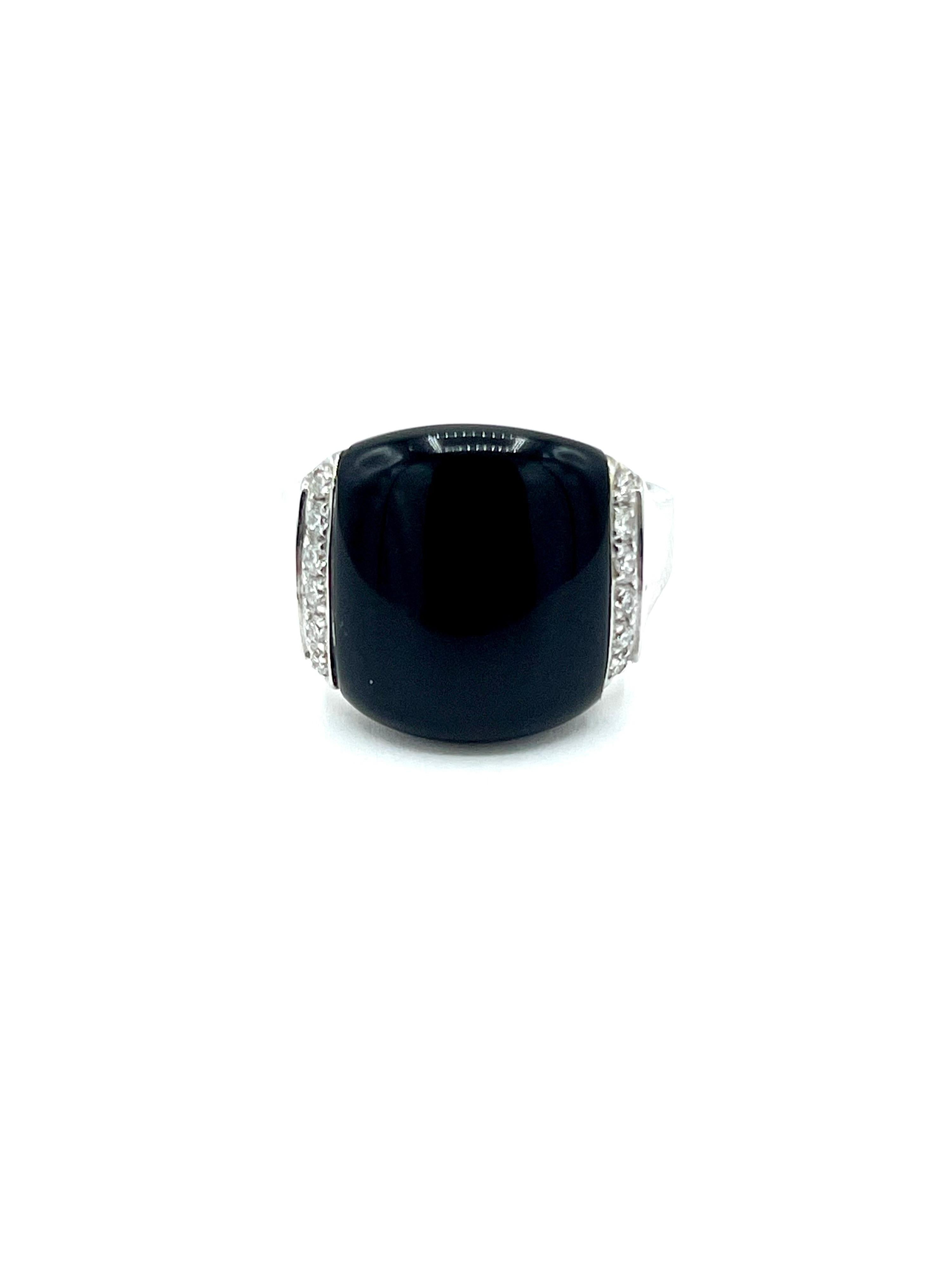A great ring to wear for any occasion!  The cabochon cut Onyx is set with a single row of round brilliant Diamonds on each side of it, in 18K white gold.  The 12 diamonds have a total weight of 0.12 carats.  The shank of the ring tapers slightly
