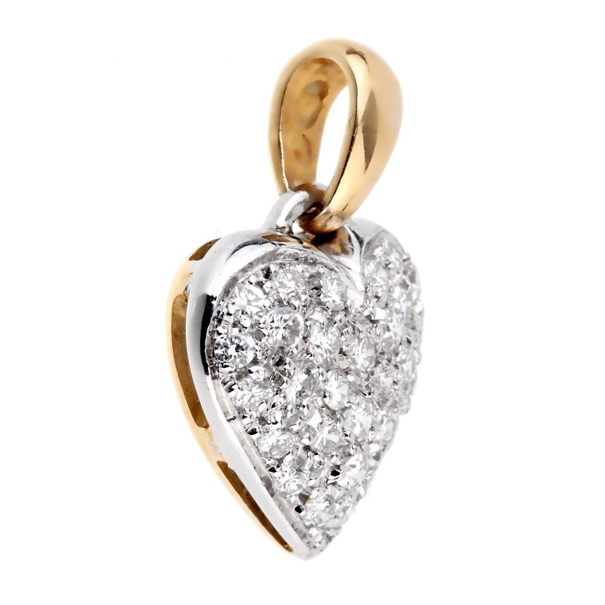 A chic heart pendant adorned with the finest round brilliant cut diamonds in 18k white and yellow gold. The diamonds weight is appx .70ct.