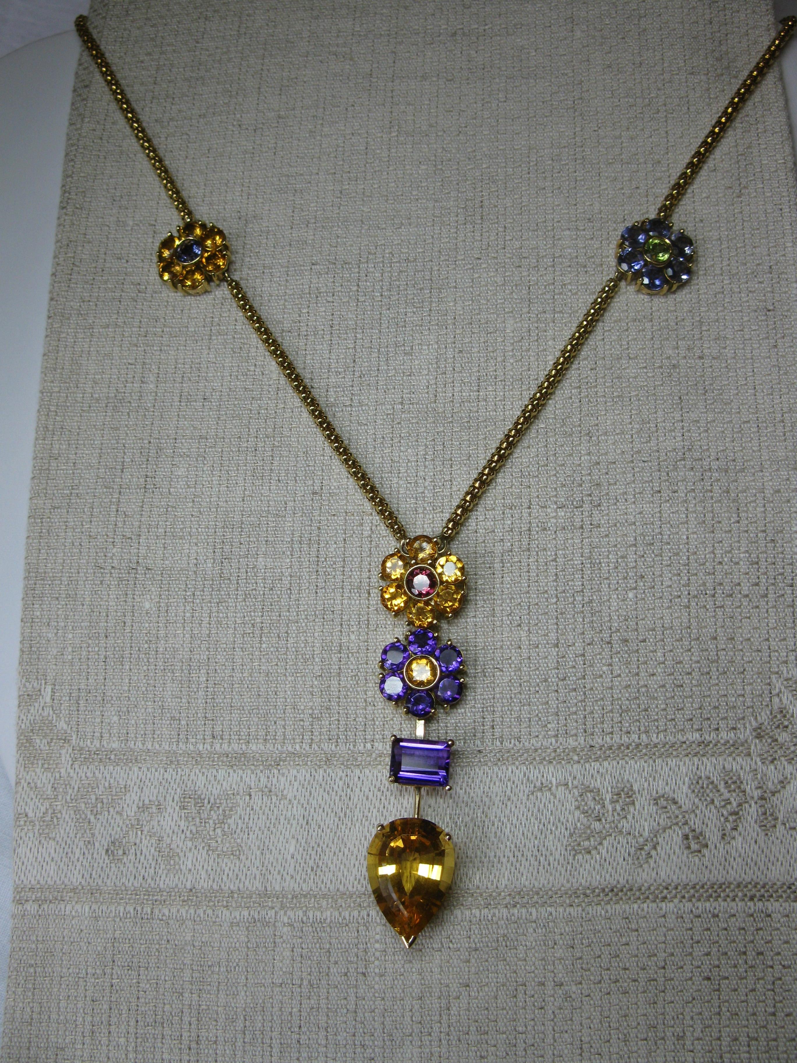 A stunning vintage Chimento Multi-Gem Necklace set with Citrine, Tanzanite, Amethyst and Peridot Flowers and Gems in 18 Karat Yellow Gold.  The effect of Chimento's gorgeous gold work with the wonderful gems creates a magical necklace!  The necklace