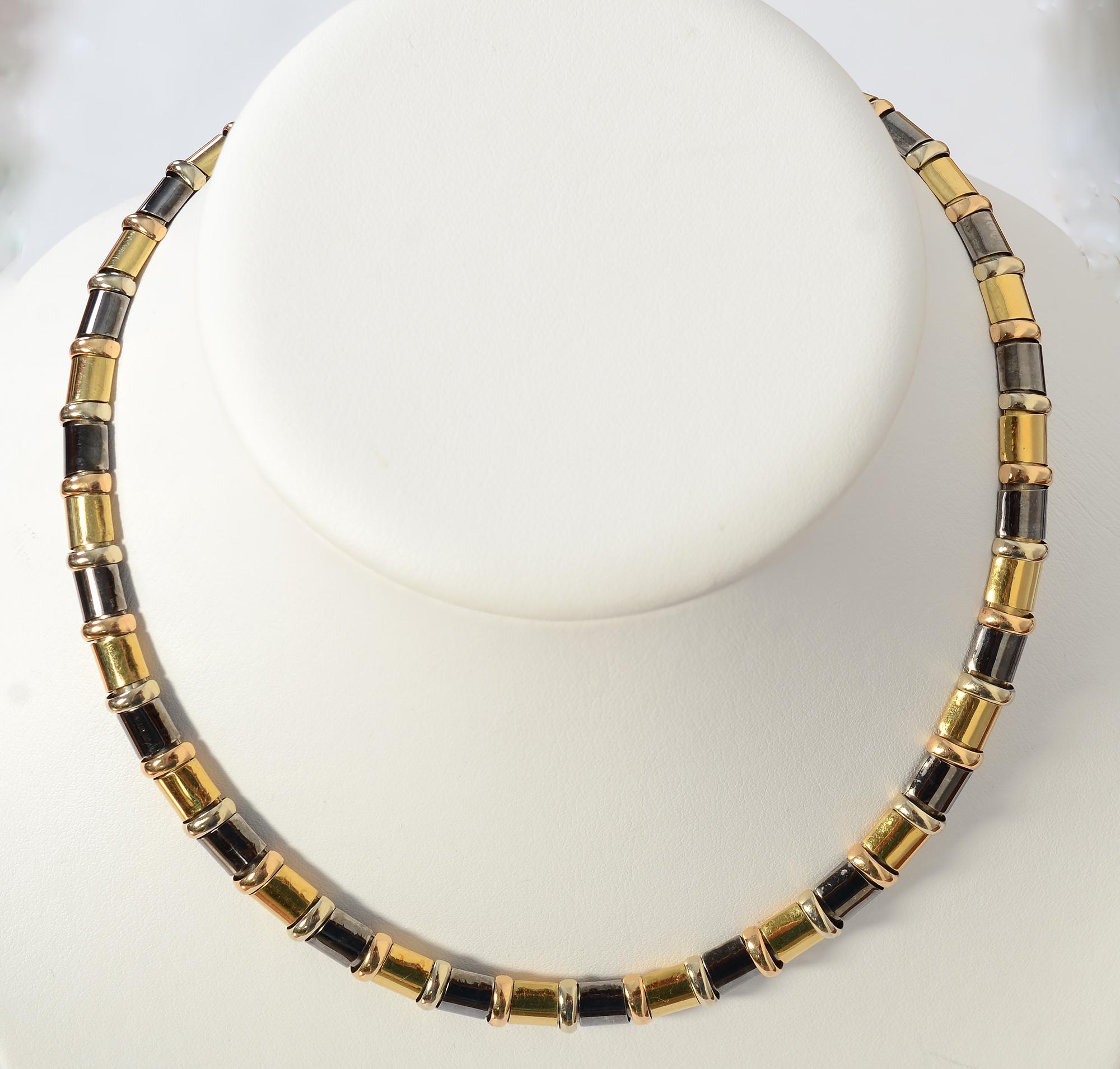 Sporty and chic two tone choker necklace by Chimento. The necklace is made of two colors of 18 karat gold alternating with oxidized sterling silver. The necklace is 16 inches long and 5/16