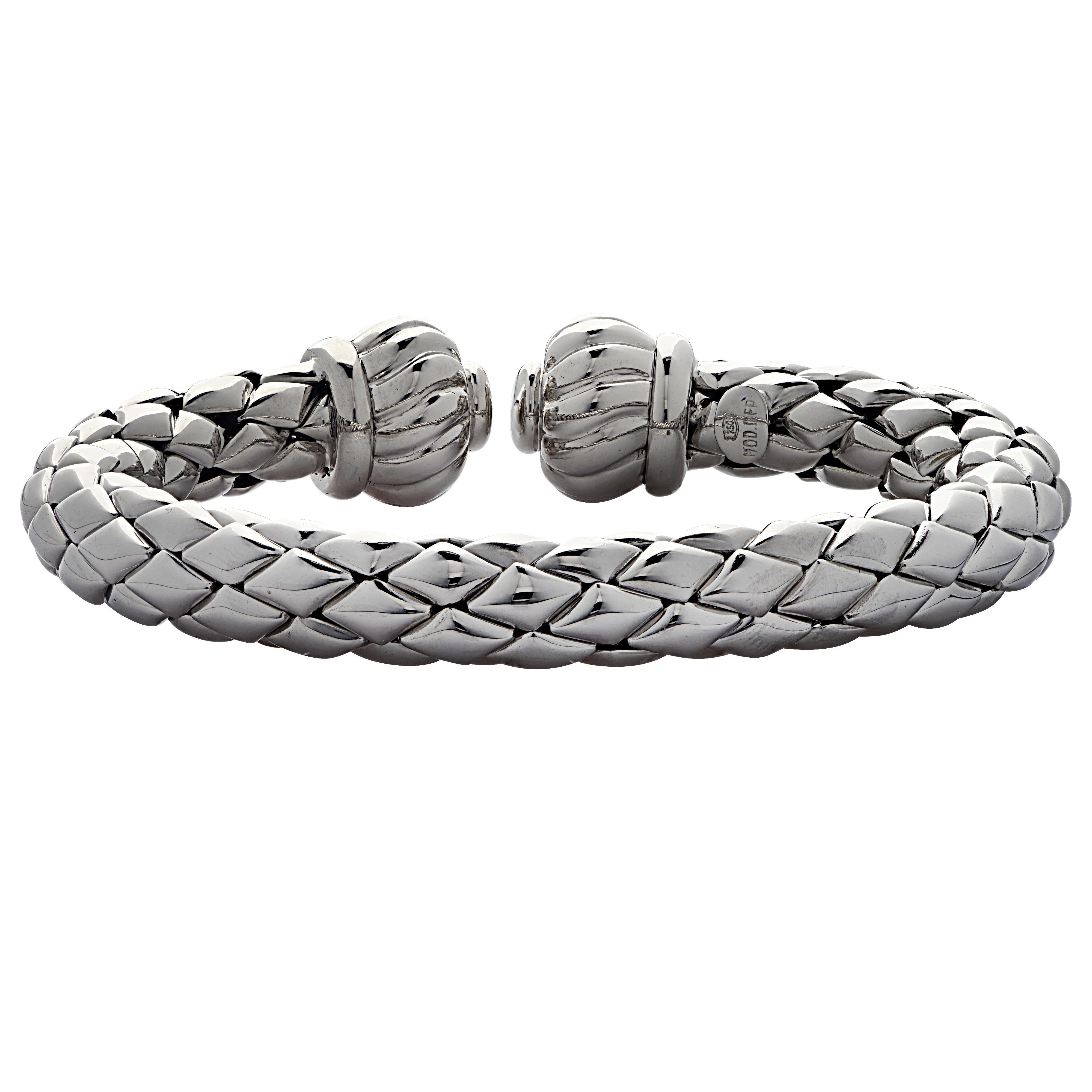 Striking Chimento bangle bracelet crafted in Italy in 18 karat white gold featuring white gold diamond shaped links forming a quilted pattern, adorned with two white gold baubles. This stunning bracelet has an inner diameter of 2.2 inches by 1.7