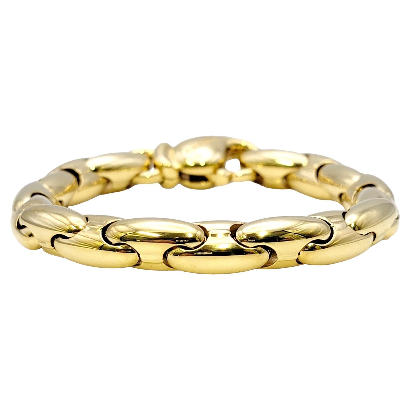 Stunning sleek polished gold designer link bracelet by Chimento. This elegant, contemporary piece features chunky oval links in luxurious 18 karat yellow gold. It would look fabulous stacked with other bracelets or simply worn on its own. 