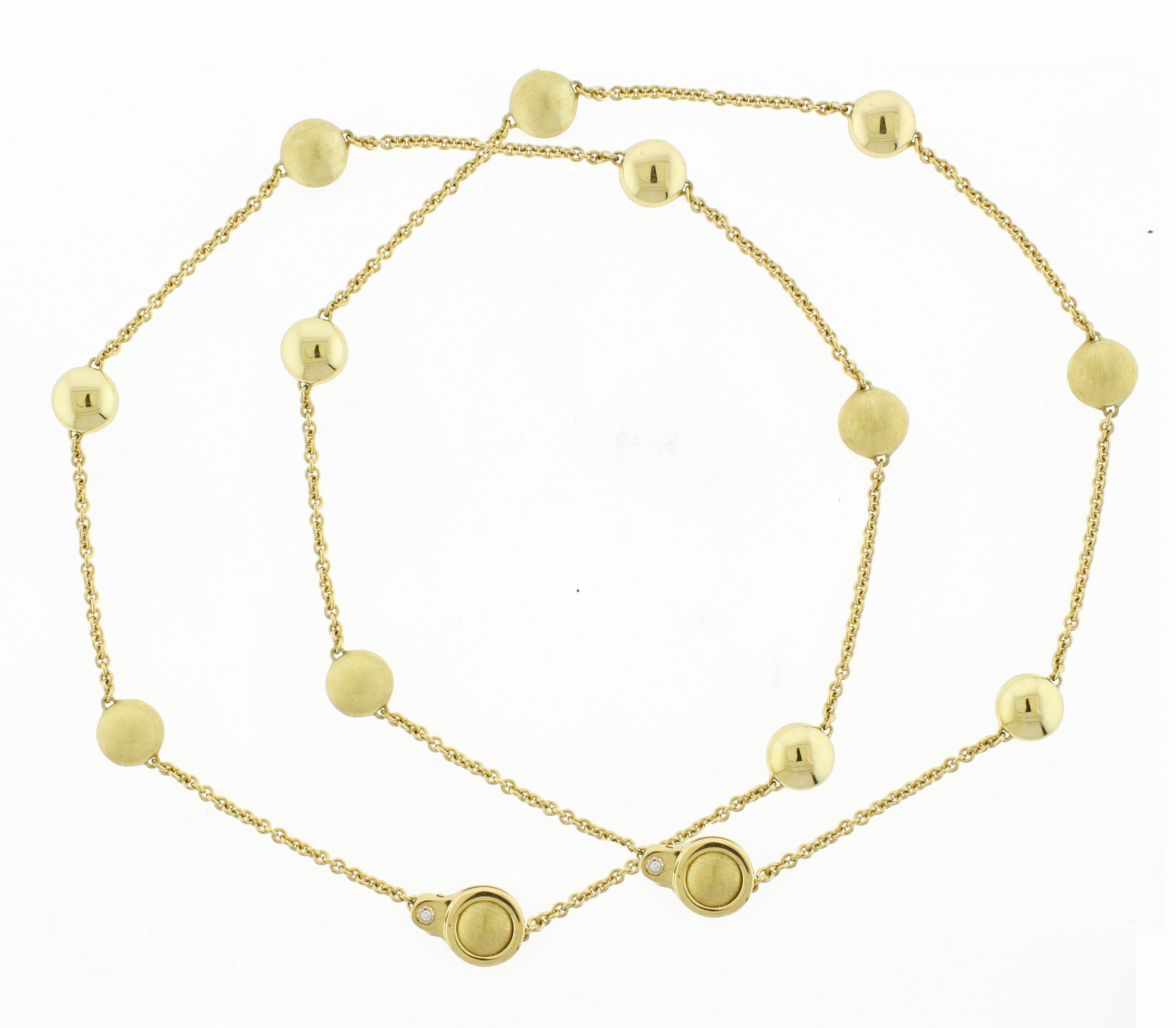 
The Chimento Sigilli Necklace is a stunning pair of versatile 18kt gold necklaces, each measuring 17 inches in length. The design features an elegant alternation between polished beads and intricately threaded matte beads, creating a sophisticated