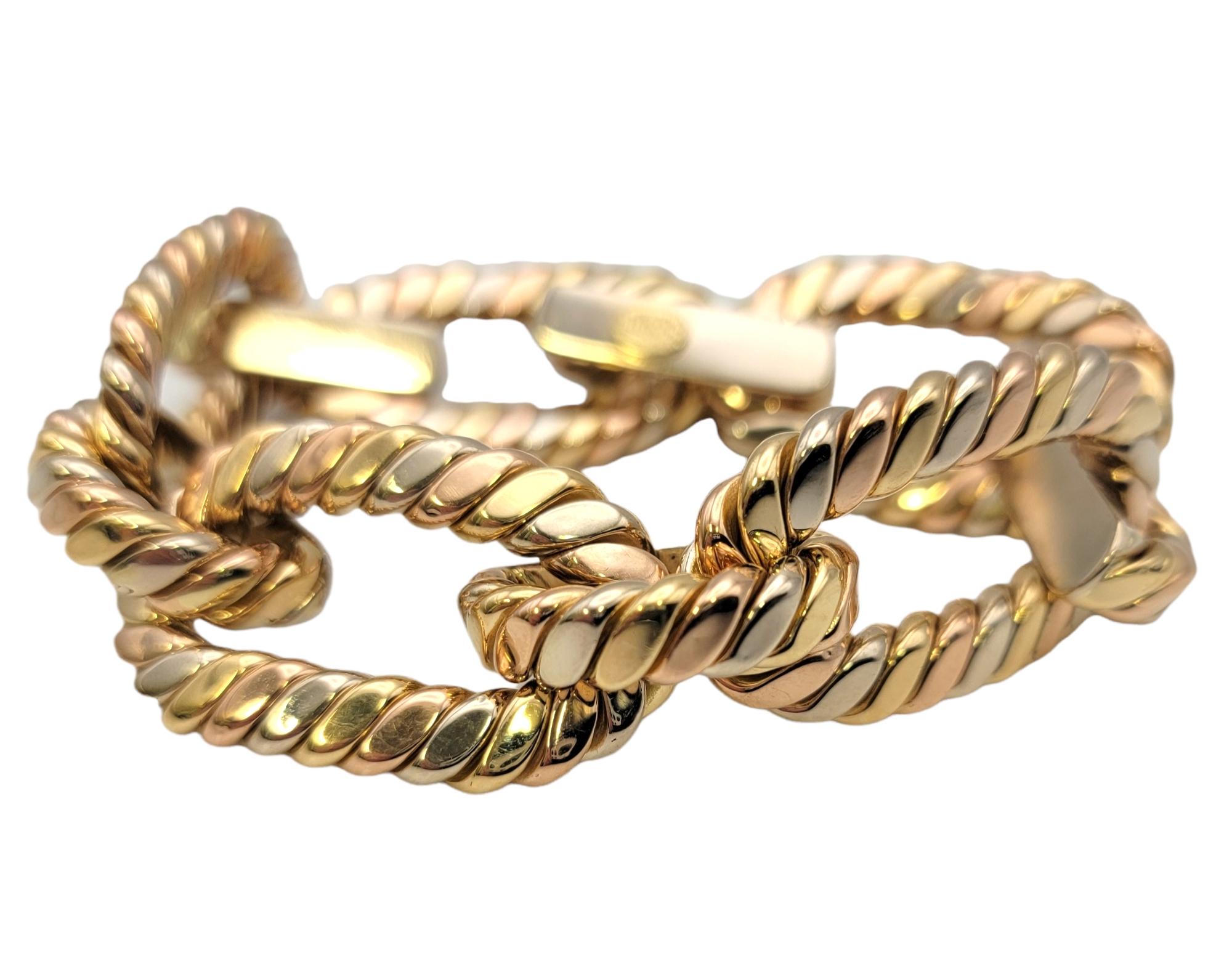 Incredible tri-tone gold designer link bracelet by Chimento in a chunky, oversized style. This bracelet was built to make a statement! Featuring 5 extra large oval-shaped links in a contrasting yellow, rose and white gold design with a twisted cable