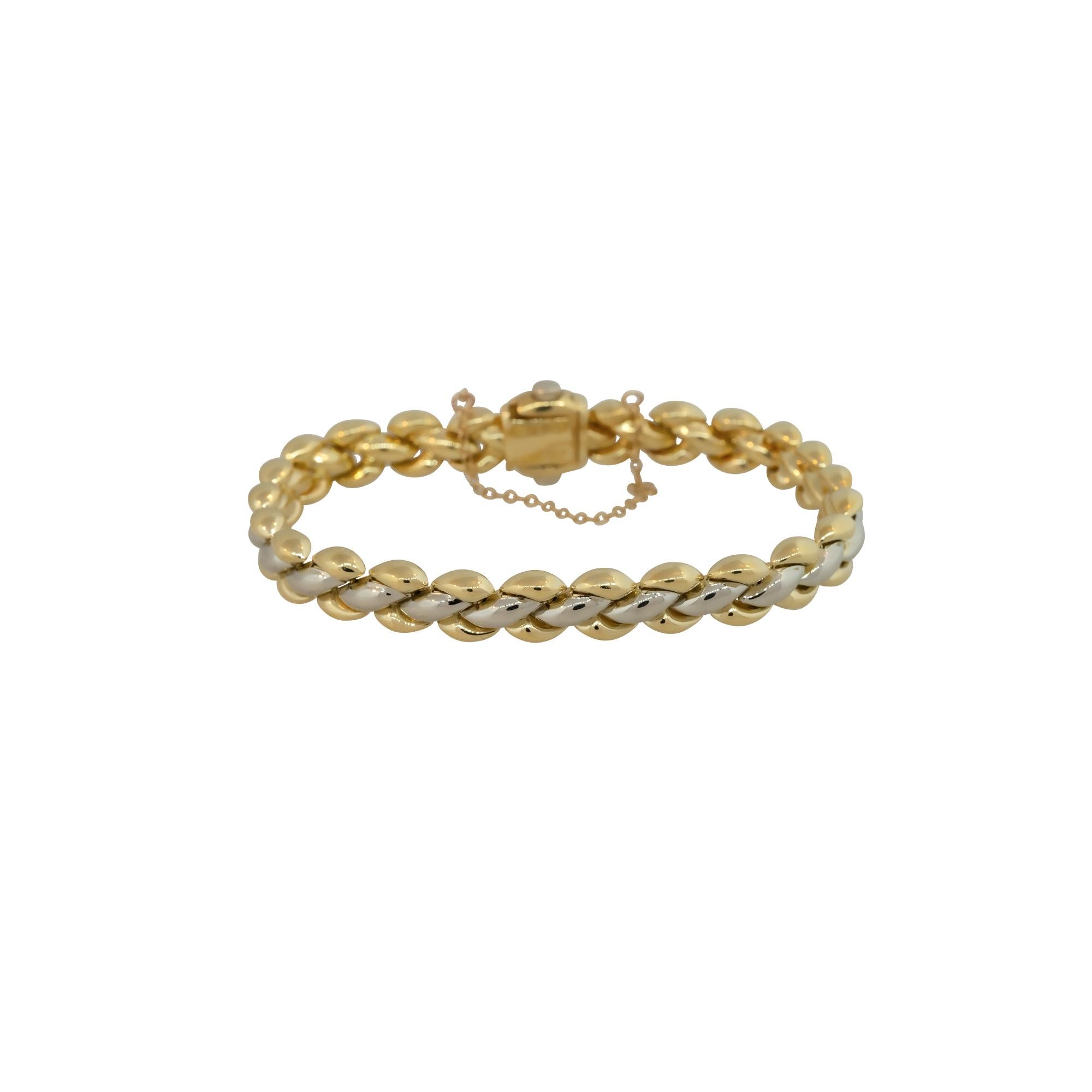 Chimento 18k Two-Tone Yellow and White Gold Reversible Women's Bracelet

Material: 18k White Gold and 18k Yellow Gold
Measurements: Bracelet Measures 7.5″ in Length and 8.5mm in Thickness
Fastening: Tongue in Box Clasp with Safety Chain
Item Weight: