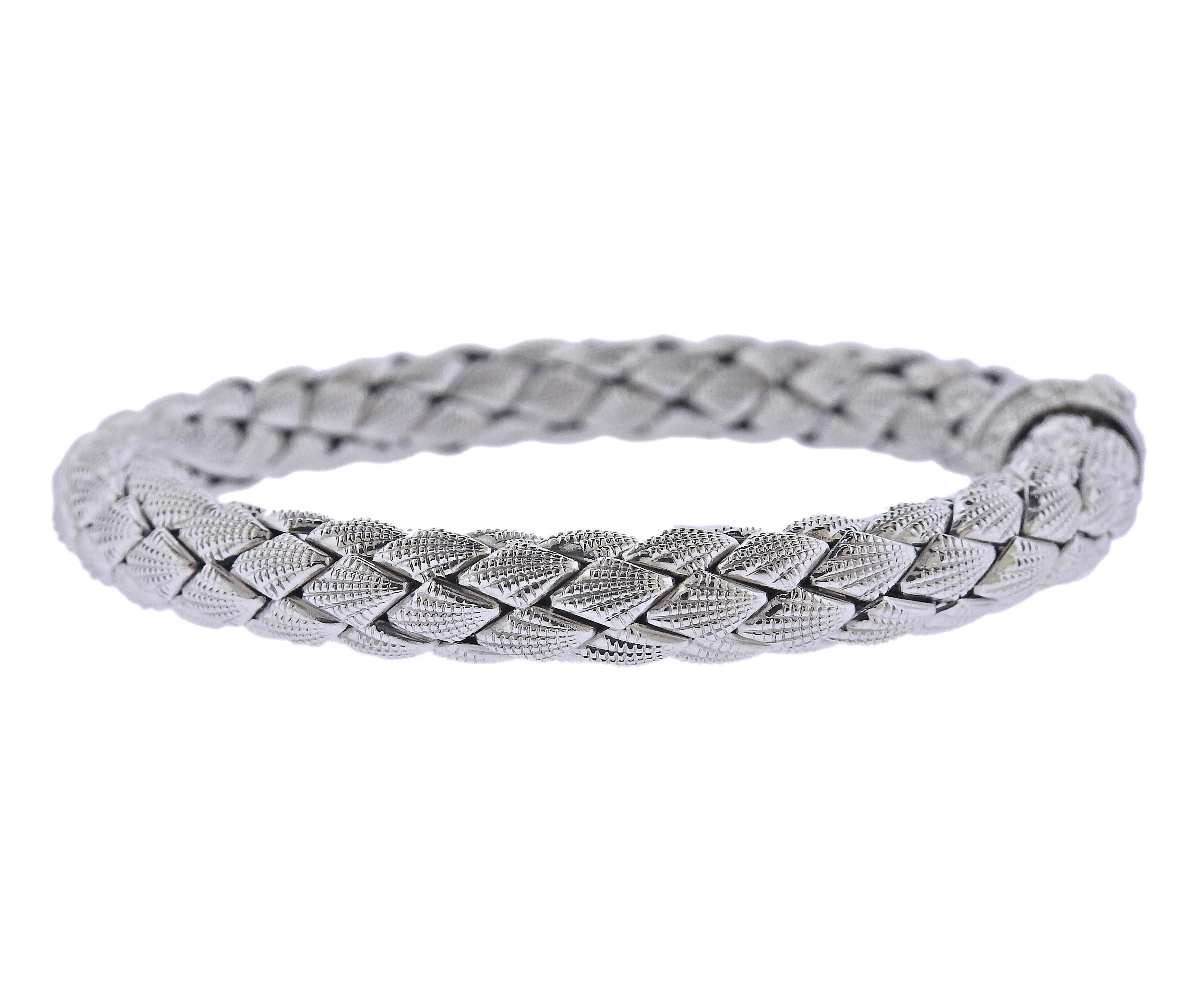 18k white gold braided bracelet by Chimento, with 0.01ct H/VS diamond on the clasp. Bracelet is 8