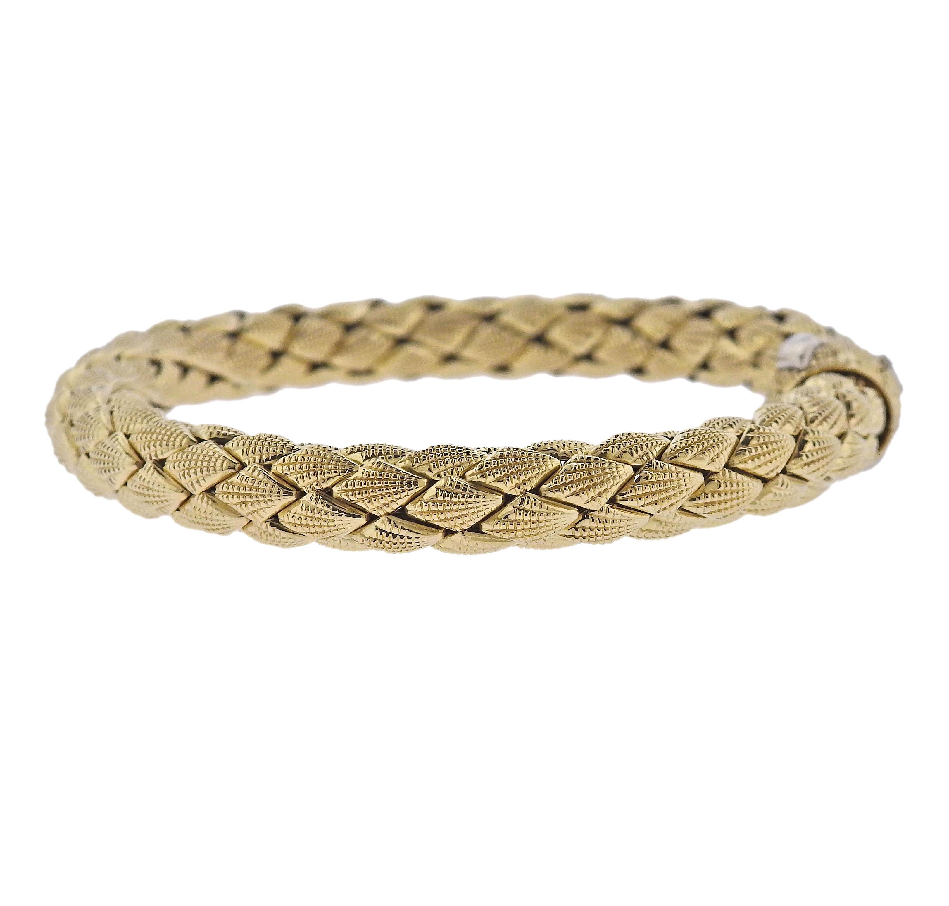 18k yellow gold braided bracelet by Chimento, with 0.01ct H/VS diamond on the clasp. Bracelet is 8