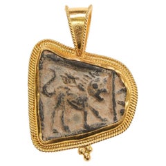 Chimera relief set in 21k gold trim