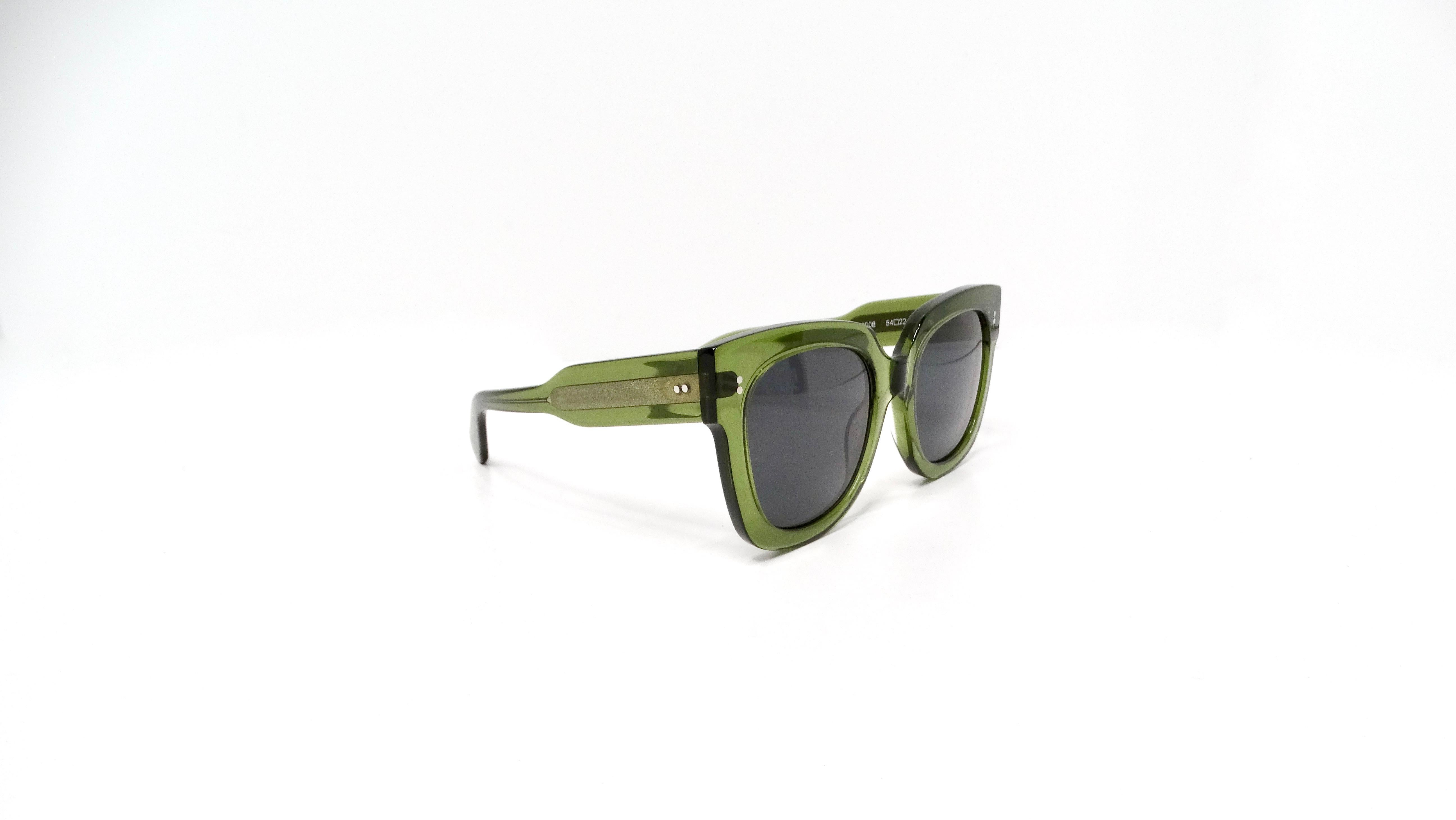 The Chimi Kiwi 008 Tinted Square Frame Sunglasses are a bold accessory that seamlessly combines fashion and function. Featuring a striking square silhouette, these sunglasses make a statement with their vivid kiwi-green colored lenses that offer UV