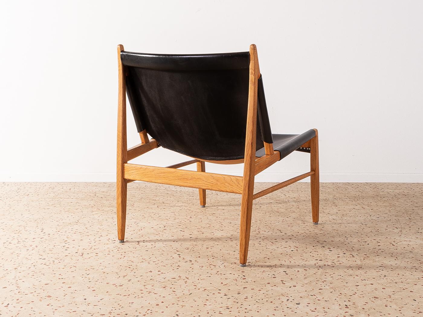 Wonderful armchair, model 1192, by Franz Xaver Lutz for WK Möbel from 1958. Solid oak frame with original leather covers in black.

Quality Features:
    accomplished design: perfect proportions and visible attention to detail
    high-quality