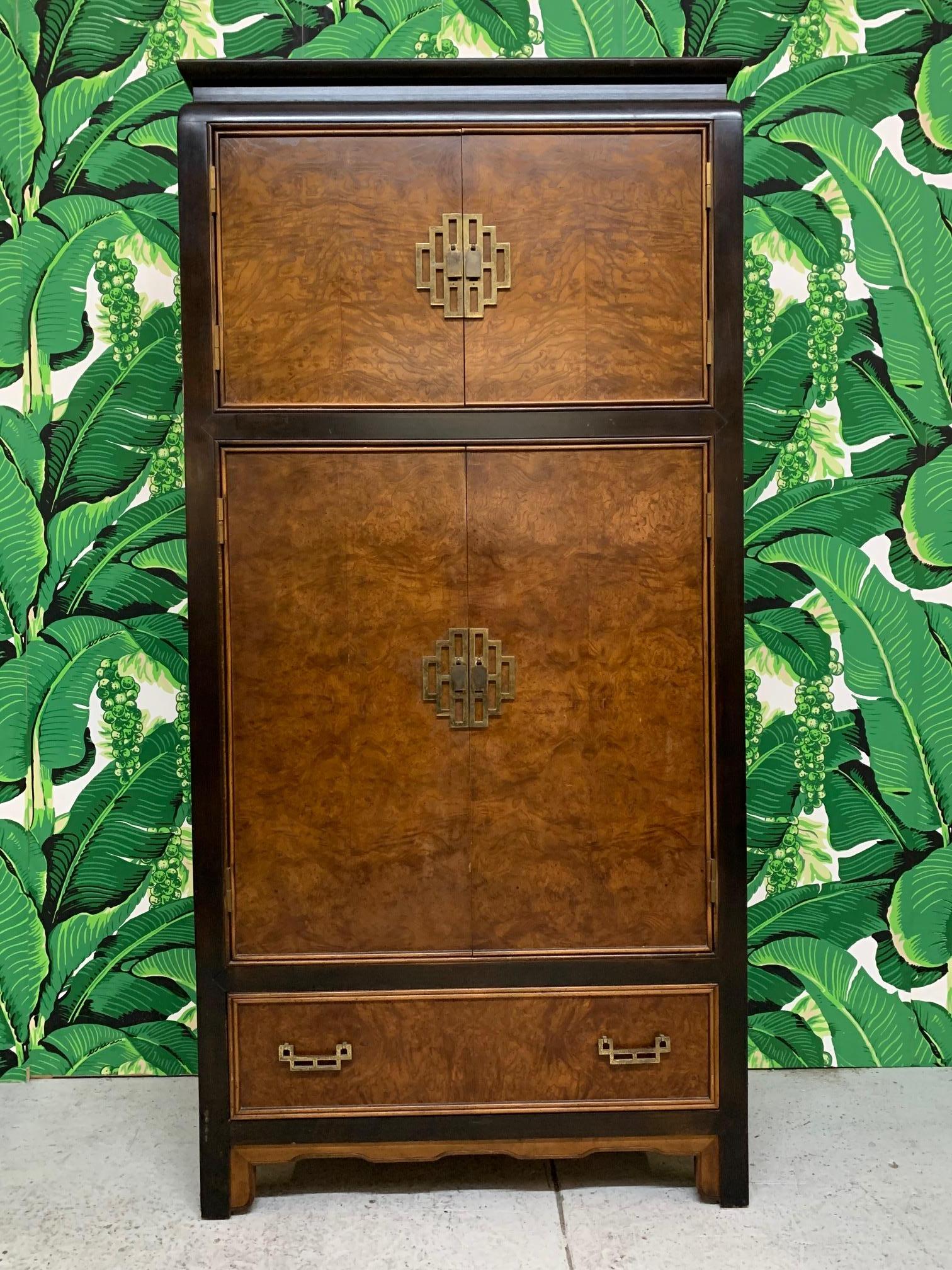 Large chinoiserie wardrobe/armoire by Century Furniture designed by Raymond Sabota as part of the Chin Hua collection. Beautiful Asian styling with burl wood and brass hardware. One drawer has been retro-fitted with keyboard slide out tray. Interior