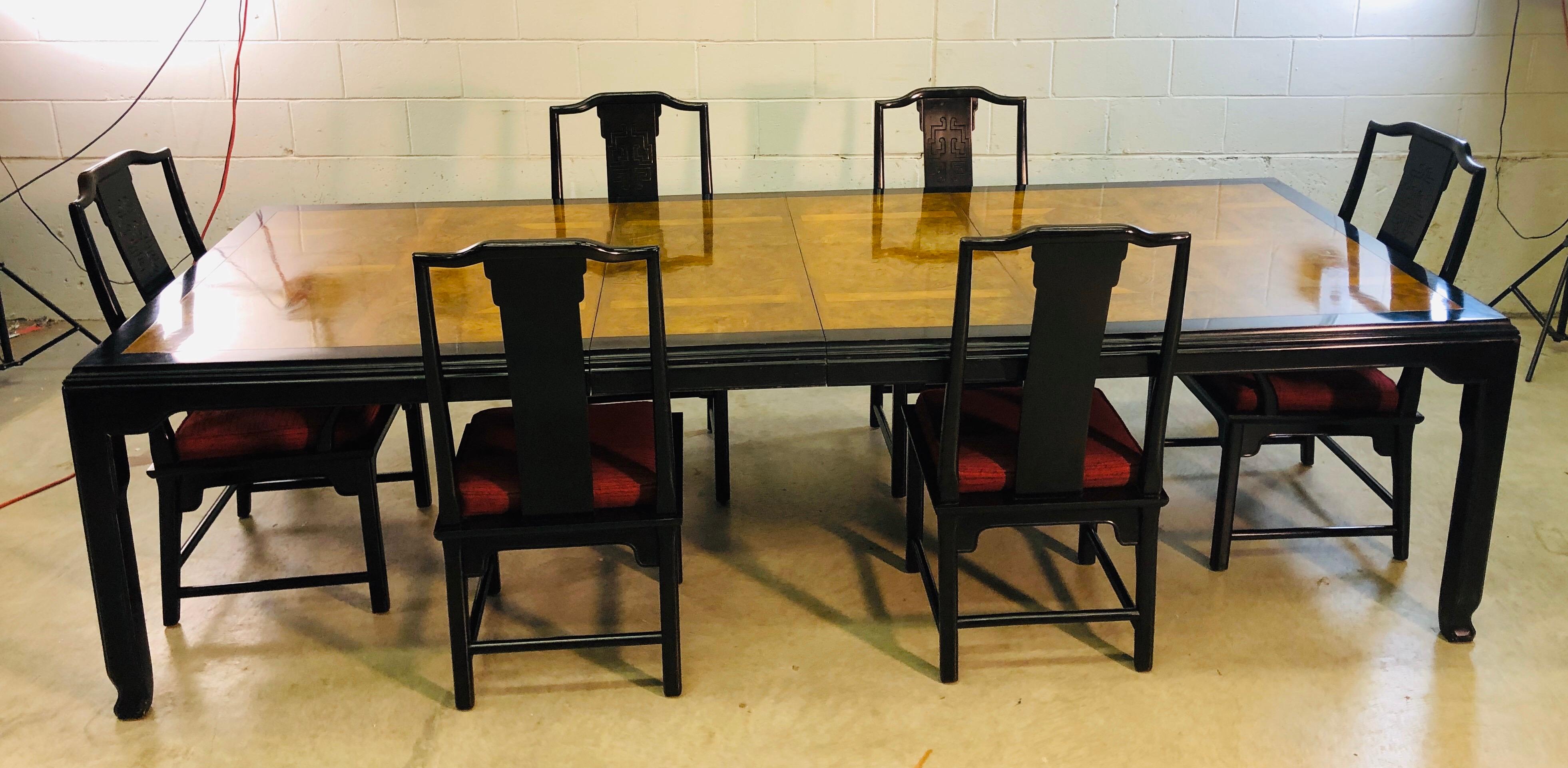 Vintage 1970s dining room table and 6 chair set with two additional boards from the Chin Hua collection designed by Raymond Karl Sobota for Century Furniture. The chairs have two captions and four side chairs. The table has a burl wood inset with an