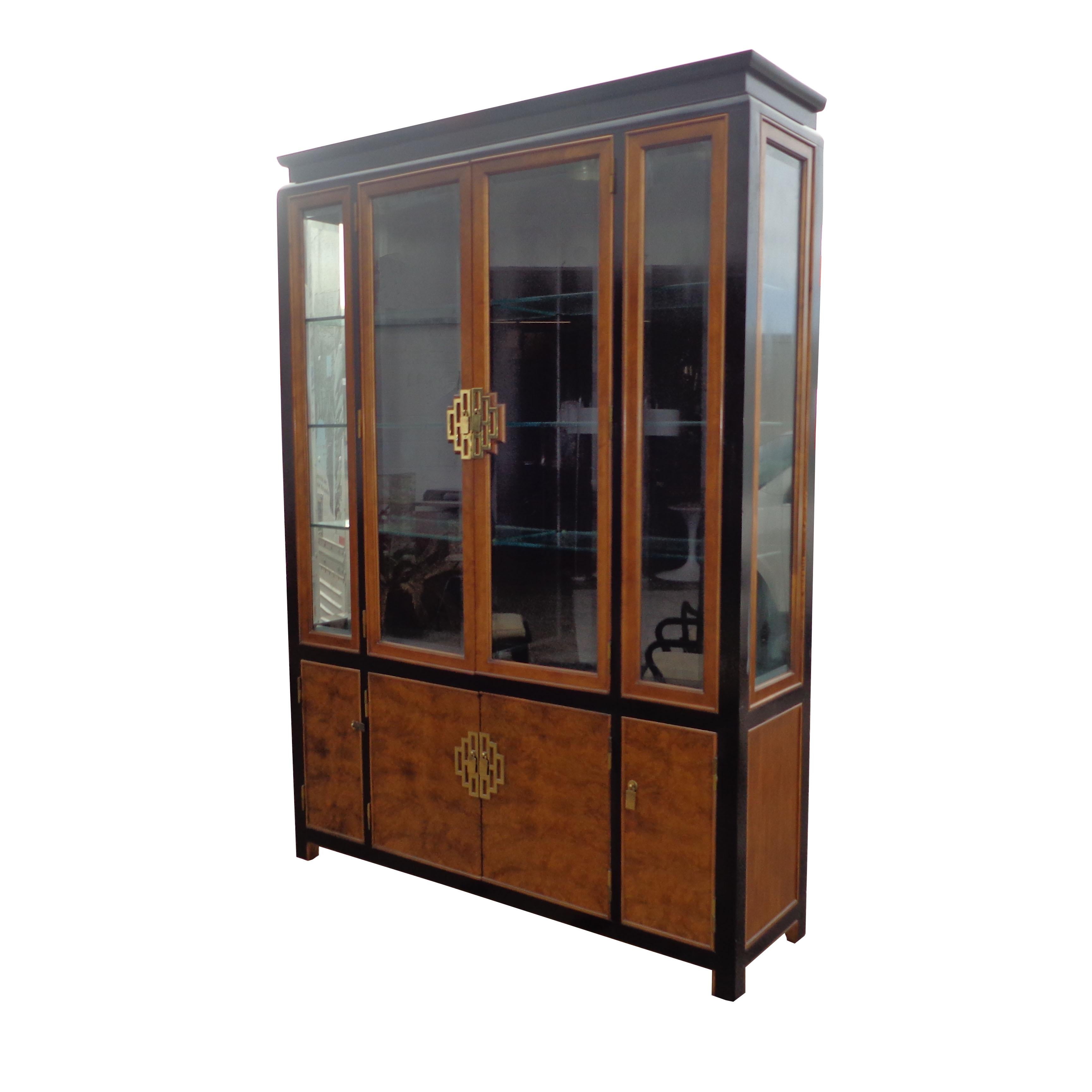 Chin Hua display cabinet by Raymond Sobota for Century Furniture

 Raymond K. Sobota started designing for Century Furniture in 1952, and was with the company for forty years.
 
Burlwood with ebonized maple accents, brass hardware, glass shelves and