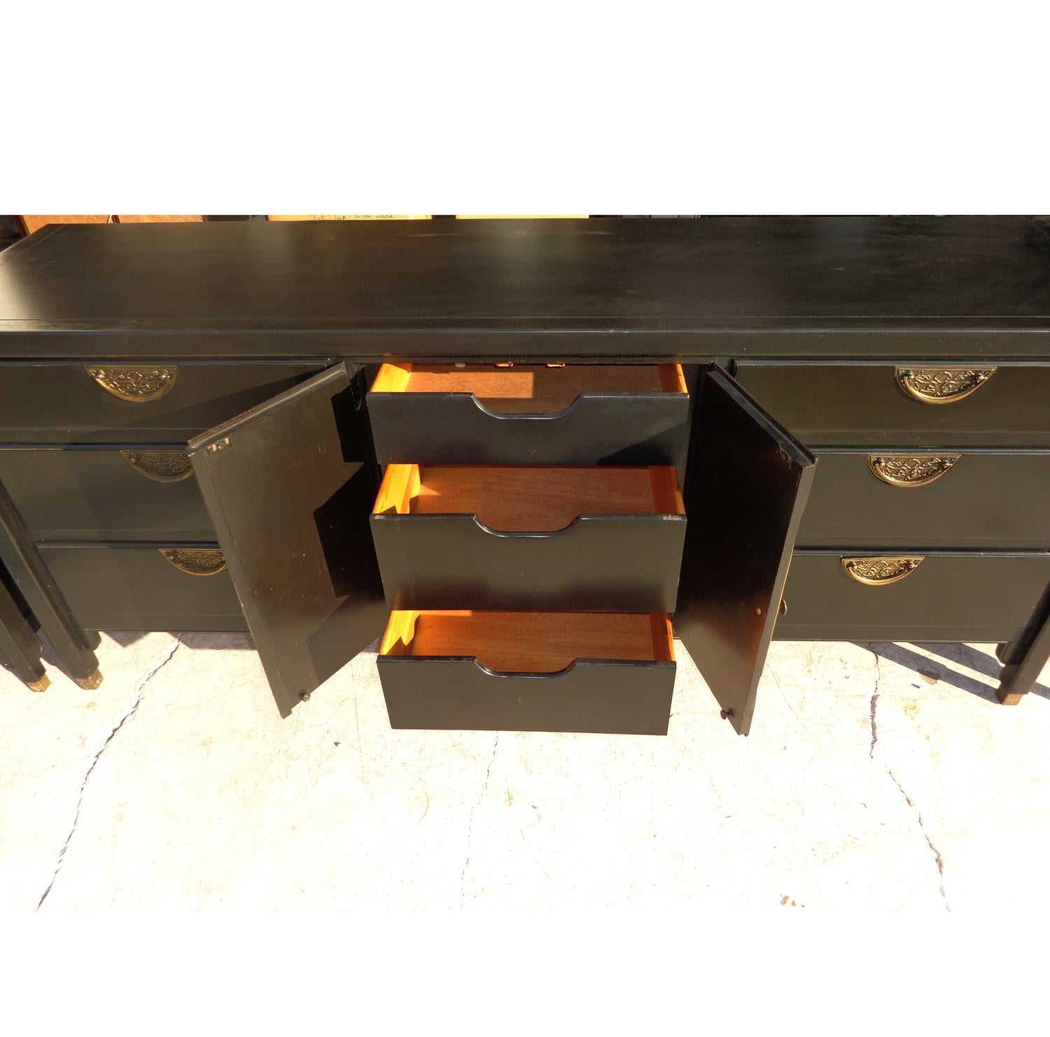 Century Chin Hua Dresser Credenza
 
Sideboard buffet or dresser manufactured by Century Furniture as part of the Chin Hua collection from the 1970s. Ebonized with beautiful brass pulls. The dresser features three drawers behind 2 cabinet doors and