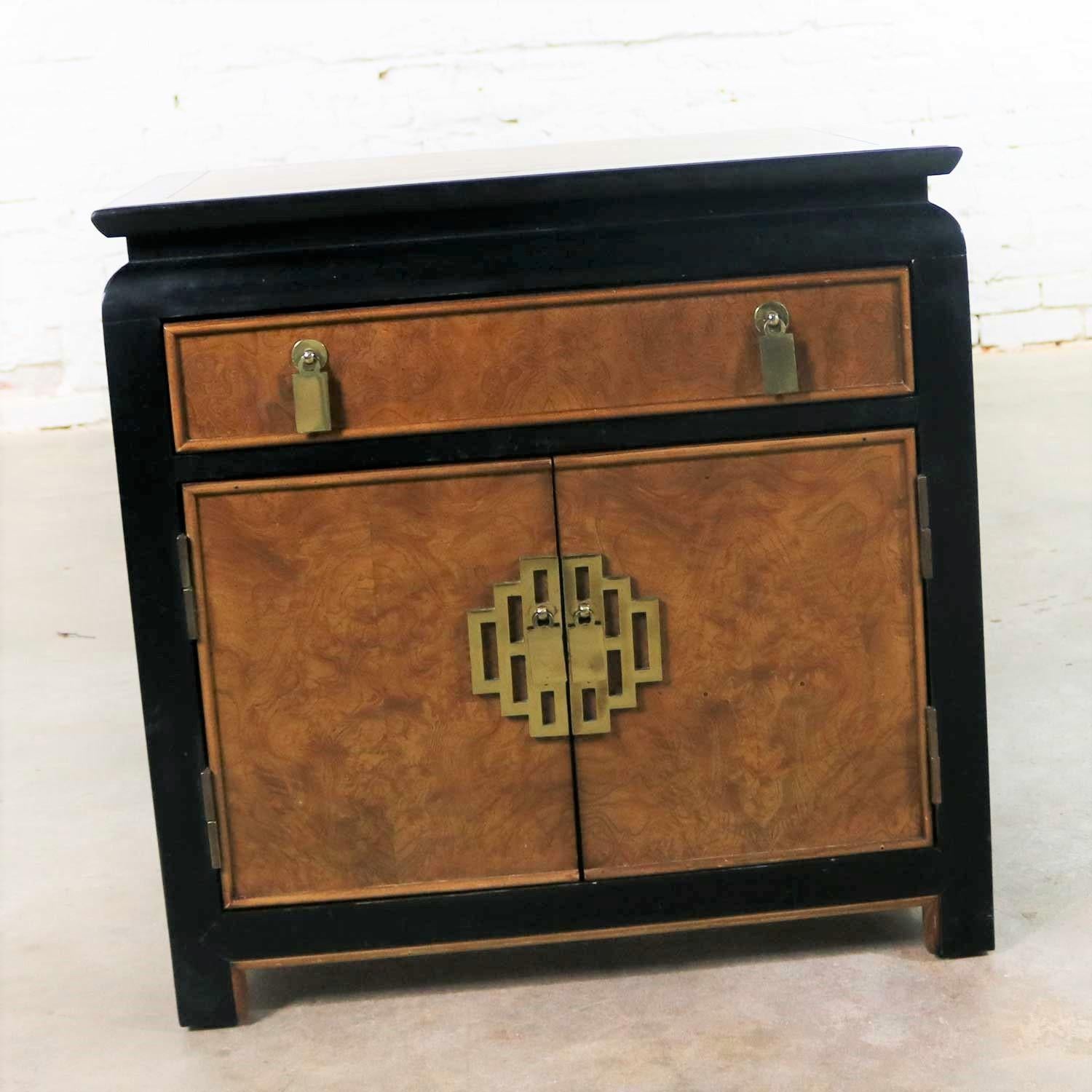 Handsome Hollywood Regency chinoiserie nightstand or end table cabinet designed by Raymond K. Sobota for his Chin Hua collection for Century Furniture. It is in wonderful vintage condition overall. It does have normal signs of age and use but