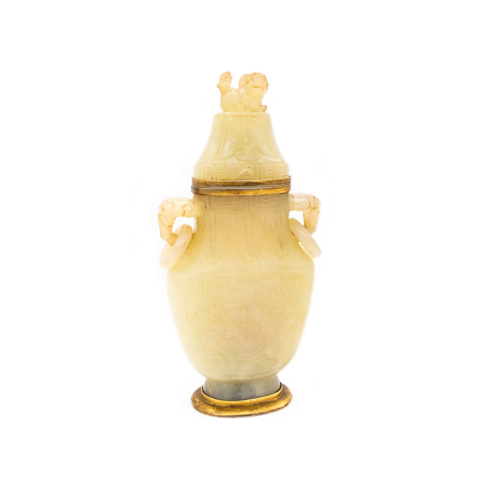 Perfume scent urn vase carved from nephrite jade Qing Dynasty (1644-1911).

An exceptional antique urn for perfumed scents from the 19th century. The carvings are from the Chinese, Qing dynasty (1644-1911) period, made circa 1800's. They are