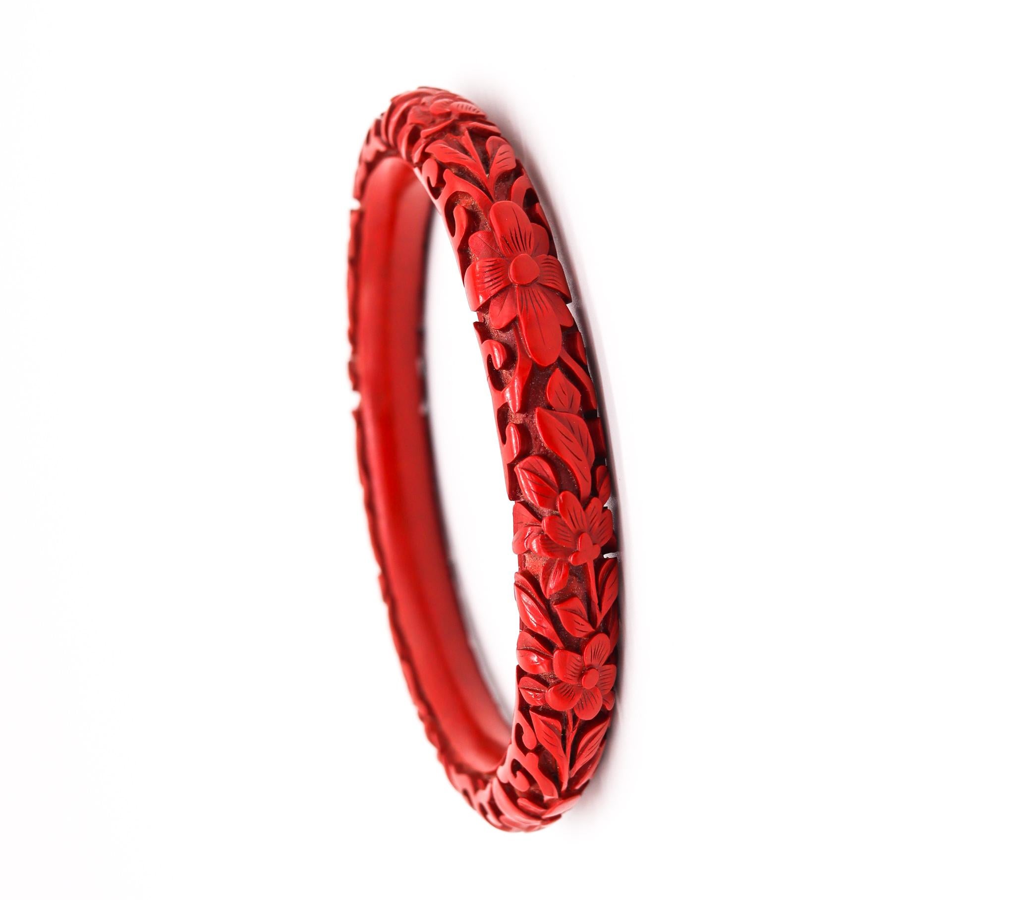 A Cinnabar lacquer bangle bracelet.

Very nice antique Chinese export bangle bracelet, made in the late 19th century during the Victorian era (1838-1901), circa 1900. It is finely made in wood with red cinnabar lacquer and carved with organic floral