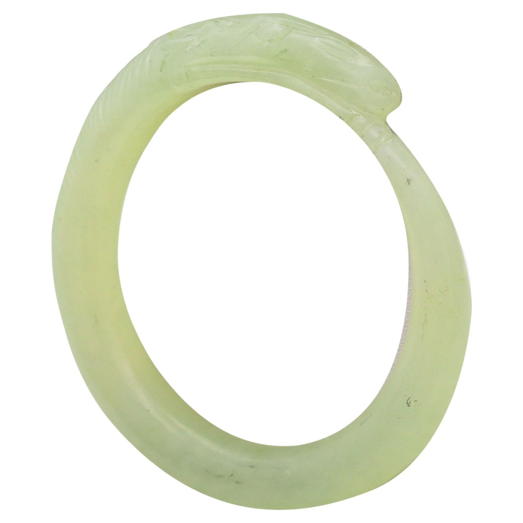 China 1900 Qing Dynasty Clear Green jade Bangle Bracelet With A Carved Horse For Sale