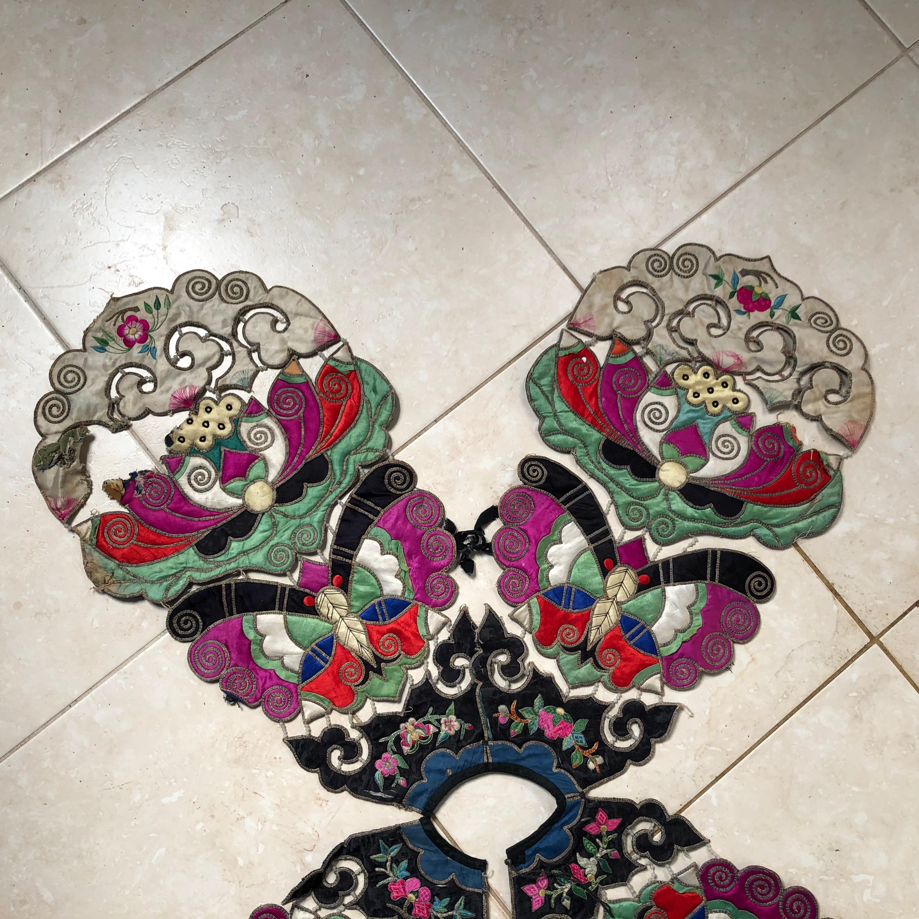 An opportunity to acquire a lovely antique Chinese hand sewn vest or colorful textile pieced together in four wing like sections, all in vibrant colors. 

Immediately wearable or frameable.

Dimensions: 40 inches by 34 inches tall and 3 inches