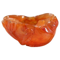 China, Brush holder in agate (carnelian) carved with relief decoration, 20th C.