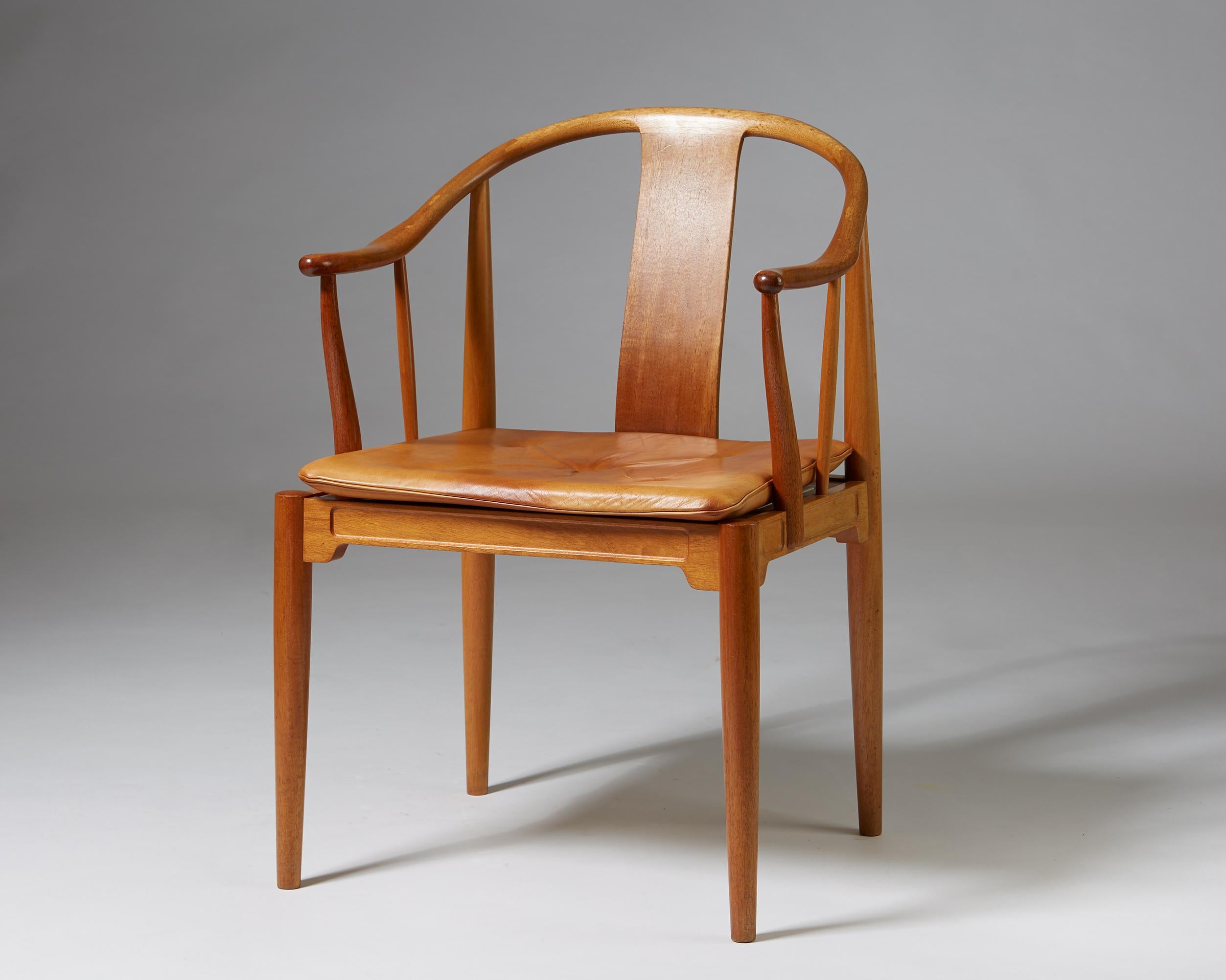 Mahogany and leather chair designed by Hans J. Wegner.
 