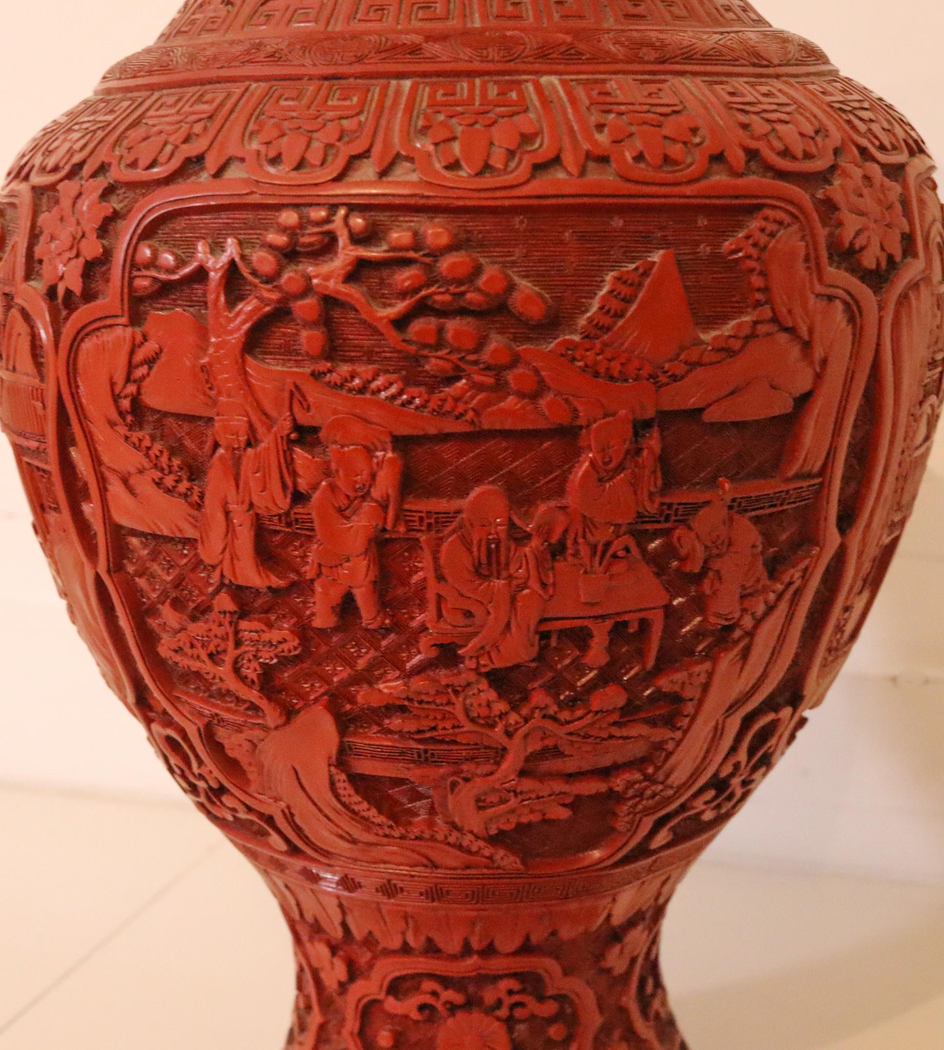 Large Chinese Carved Cinnabar Vase with brass lining.

Very nice antique Chinese export vase, created during the Victorian era (1838-1901), back in the 1900. It is finely carved with a bombe baluster shape in vivid red cinnabar and depicts five