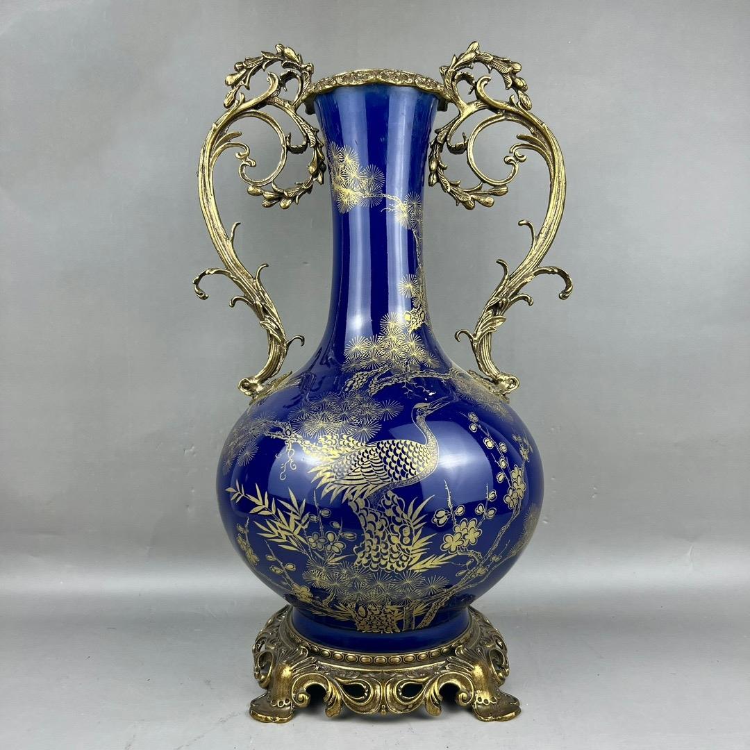 China Hand Painted Porcelain Vase with Bronze Bottom and Handle

Delicate China porcelain vase with real gold hand painted cranes pine trees representing longevity and good luck, early 20th century.

Measures: H: 45.5cm, D: 26cm.