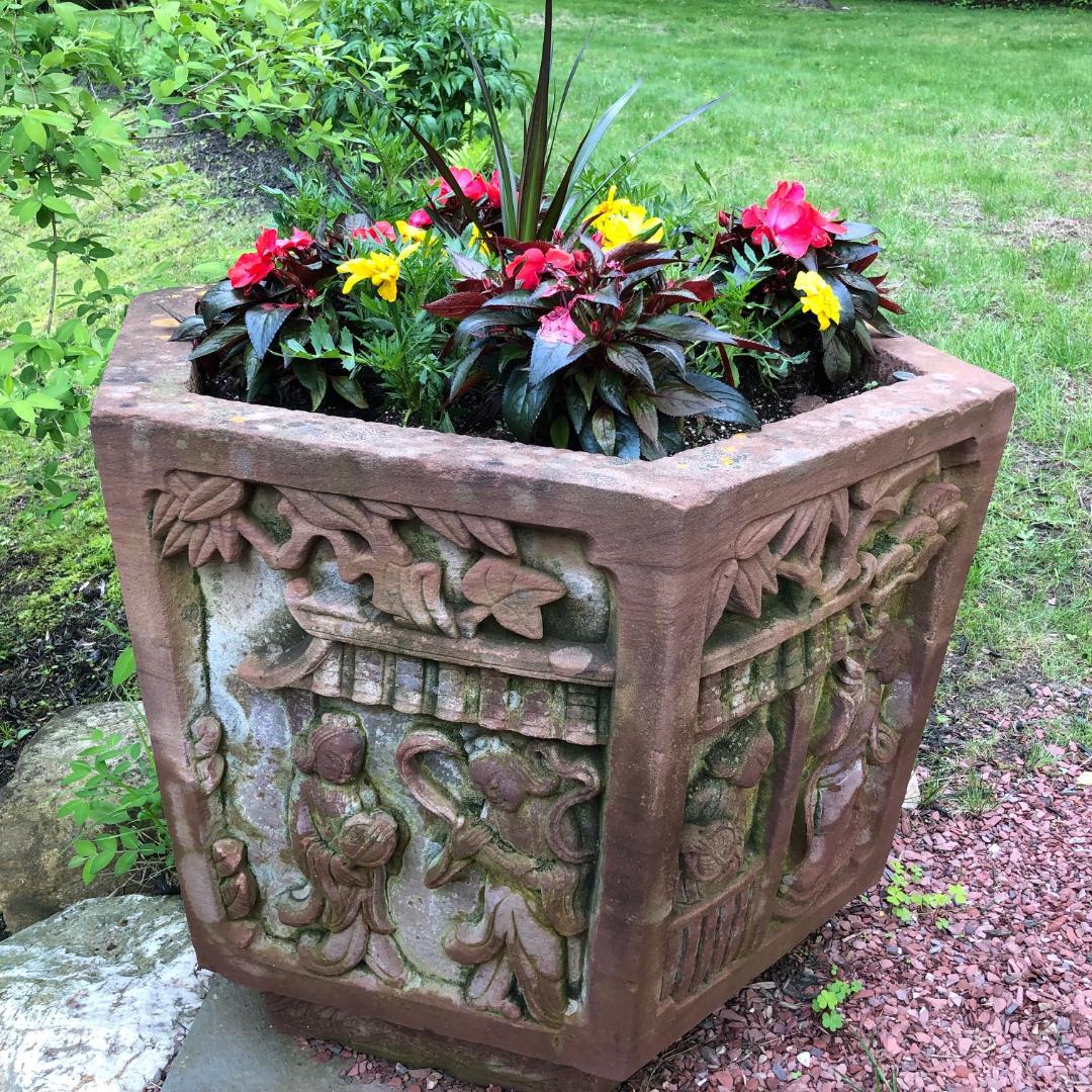 A lovely antique example for your special garden space.  Qing period (1800-1912)

China hand carved antique hexagonal shaped red sand stone planter/ basin with deeply carved village scene side panels.

Dimensions:  23 inches high and  31 inches