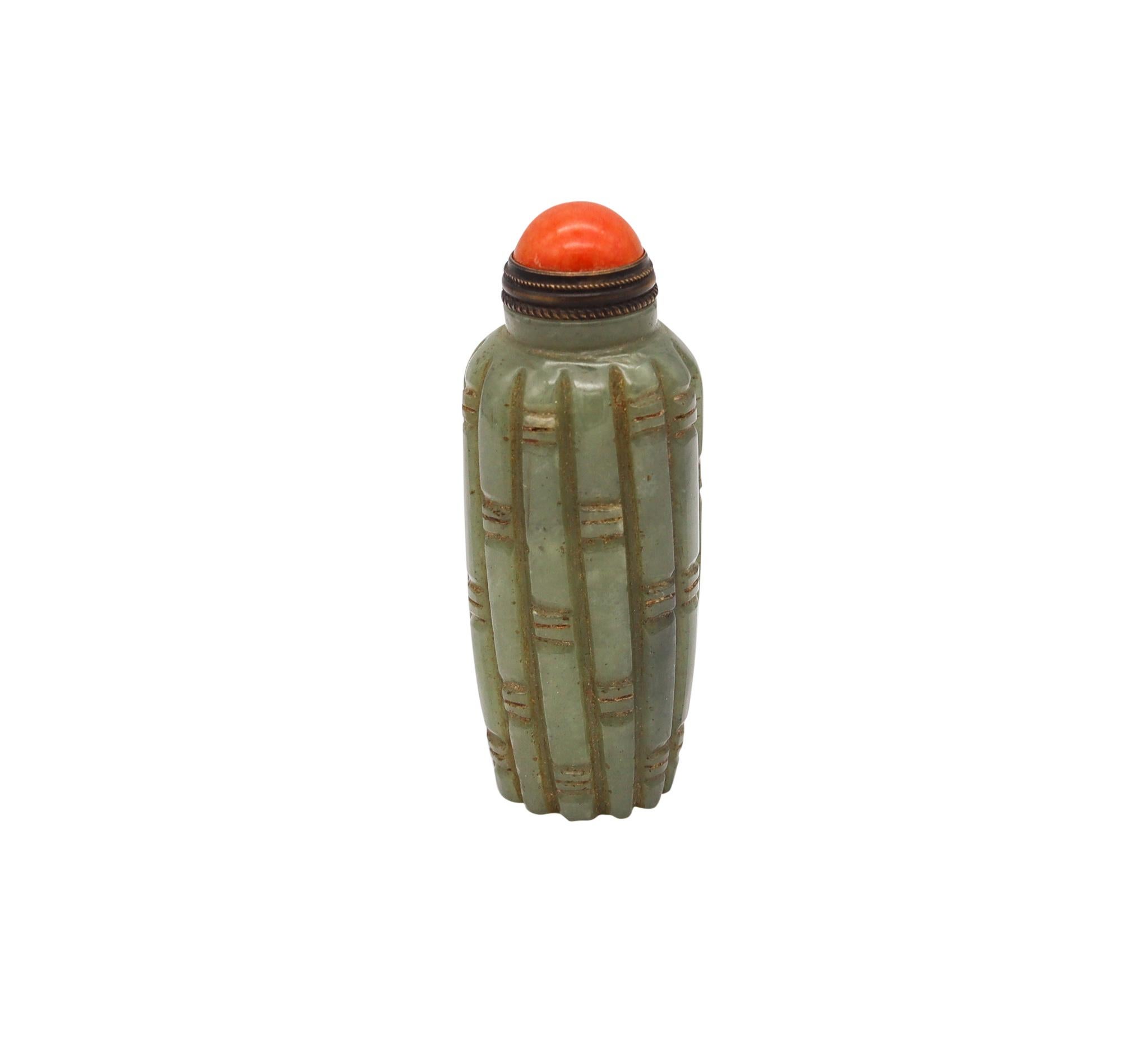 Chinese Snuff bottle from the Qing Dynasty (1644-1912),

Beautifully carved snuff bottle from the imperial Chinese period of the Qing Dynasty. This snuff bottle was carved back in the 1880 in the shape of a bunch of bamboos trees from a single