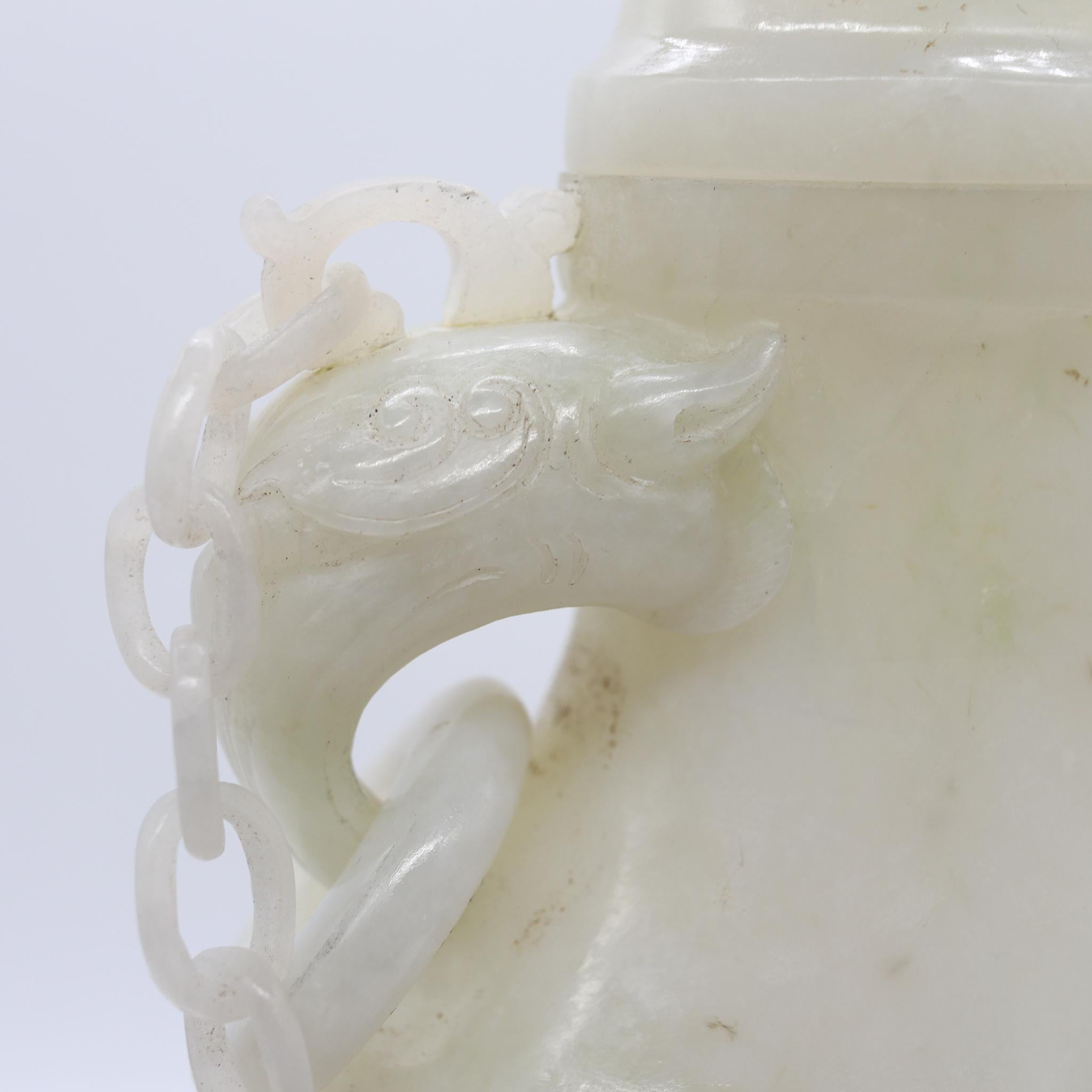 Urn Jar carved from Jadeite jade Qing Dynasty (1644-1911).

An exceptional carved antique lidded covered urn, from the late Qing dynasty (1644-1911) period, circa 1890-1910. They were carved from a single solid piece of natural jadeite white jade