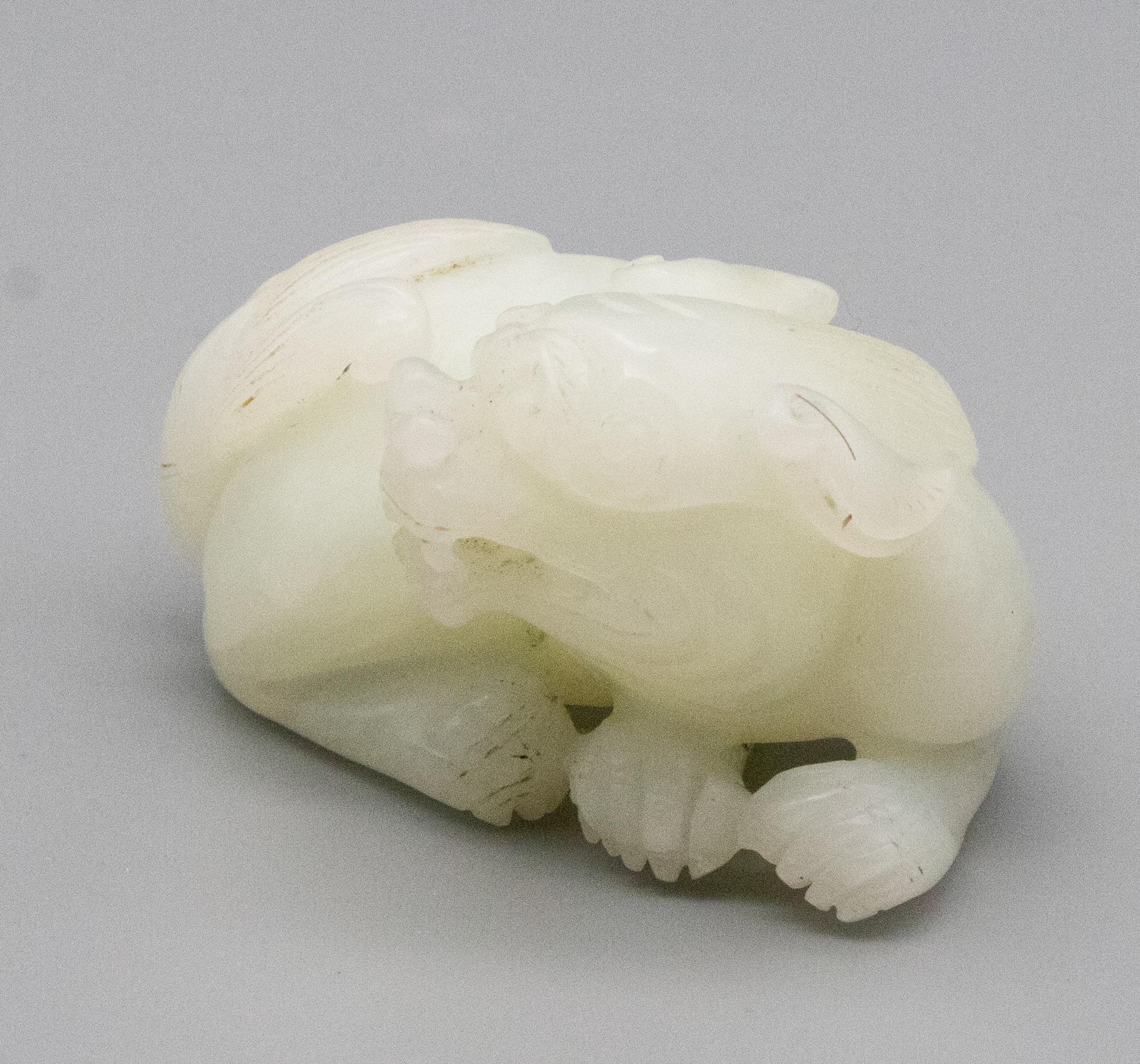 China Qing Dynasty 18th Century Reclining Foo Dog Carved in White Nephrite Jade 4