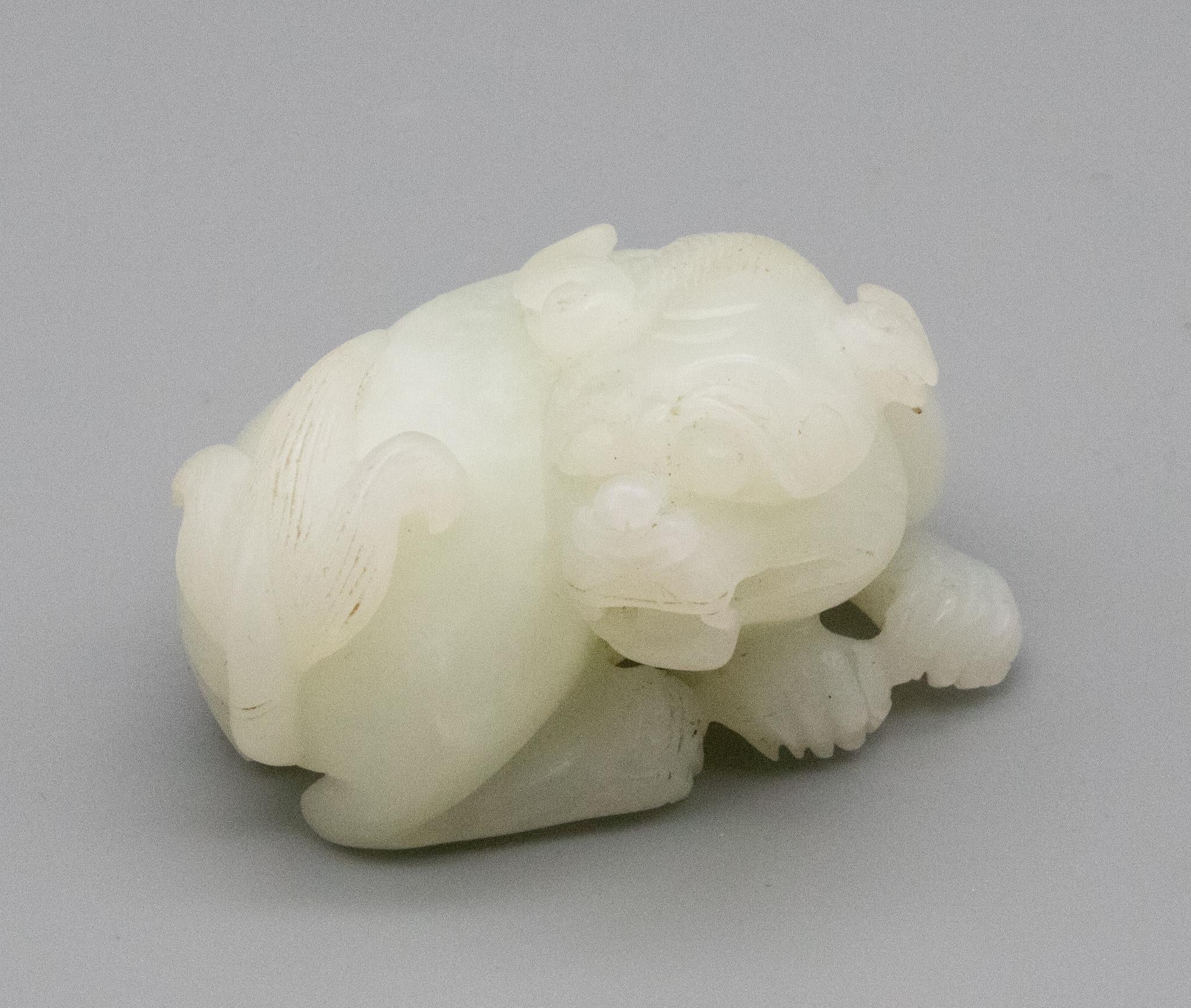 China Qing Dynasty 18th Century Reclining Foo Dog Carved in White Nephrite Jade 5