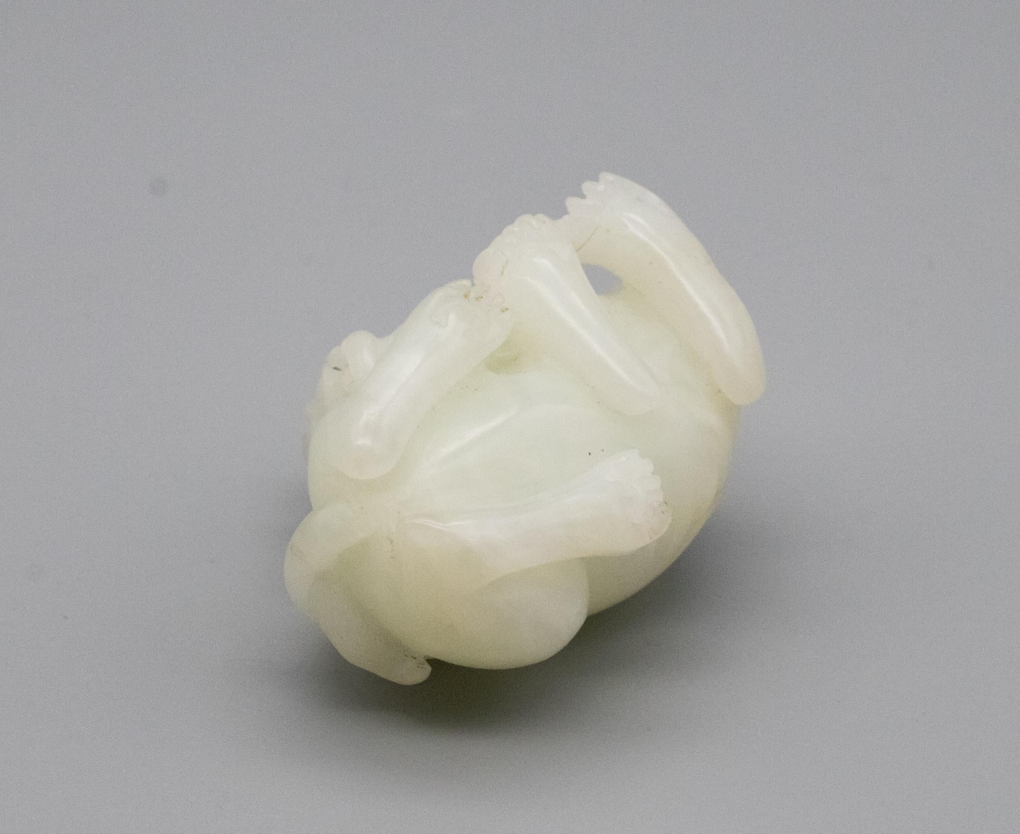 18th Century and Earlier China Qing Dynasty 18th Century Reclining Foo Dog Carved in White Nephrite Jade