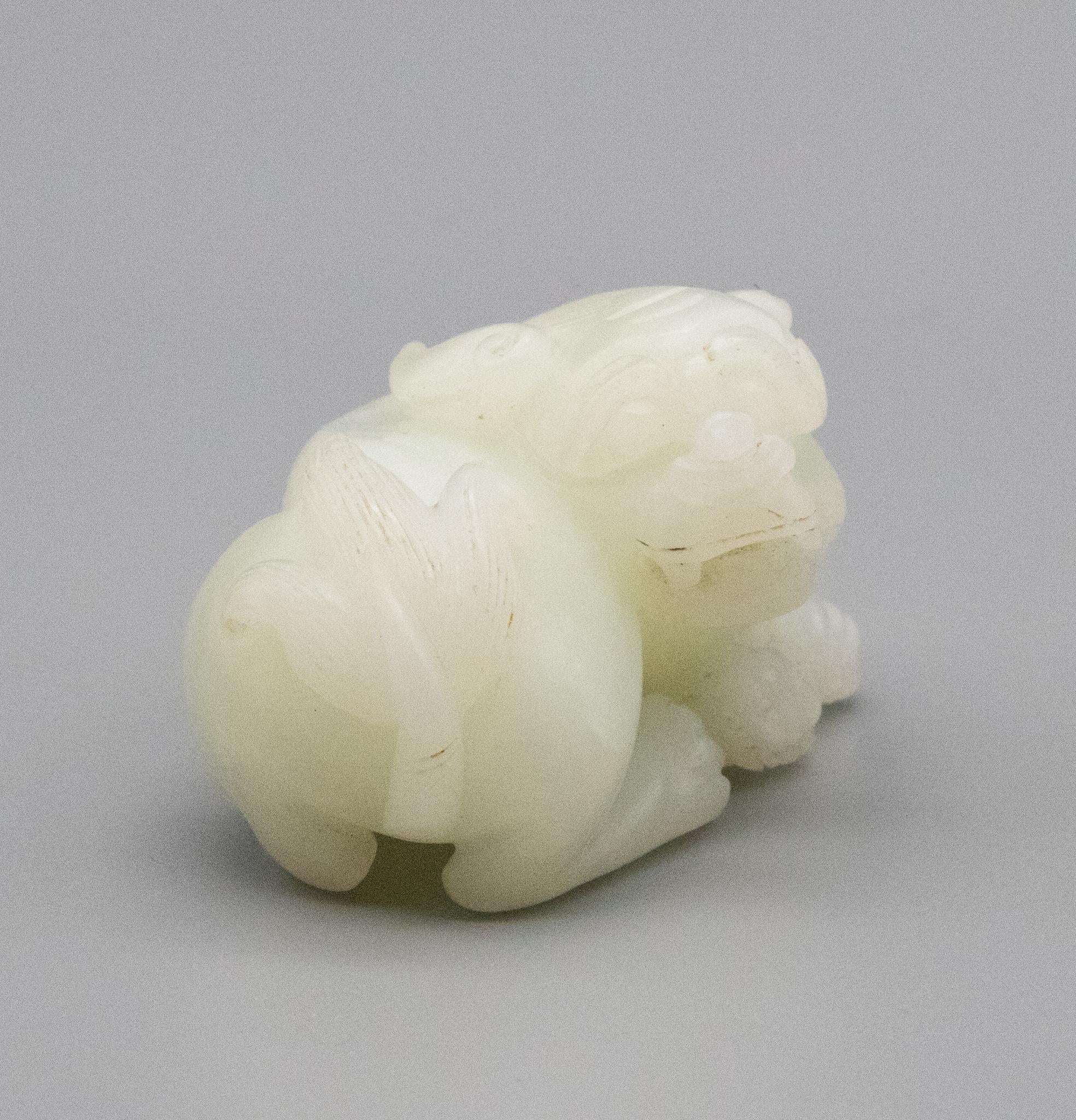 China Qing Dynasty 18th Century Reclining Foo Dog Carved in White Nephrite Jade 1
