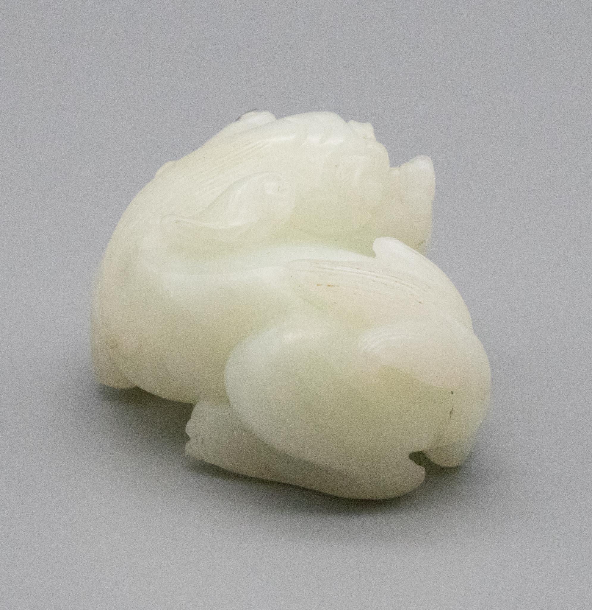 China Qing Dynasty 18th Century Reclining Foo Dog Carved in White Nephrite Jade 2