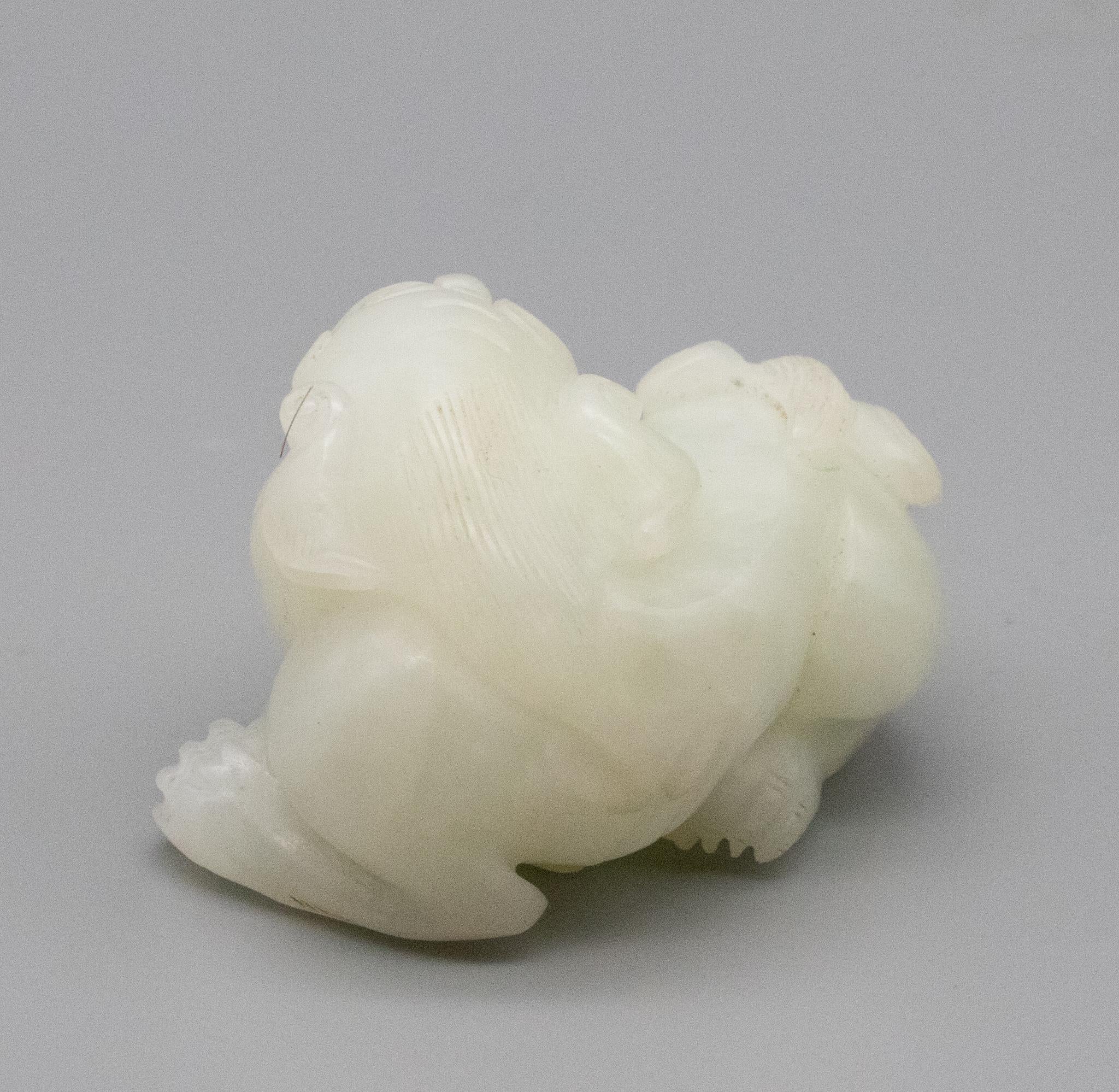 China Qing Dynasty 18th Century Reclining Foo Dog Carved in White Nephrite Jade 3
