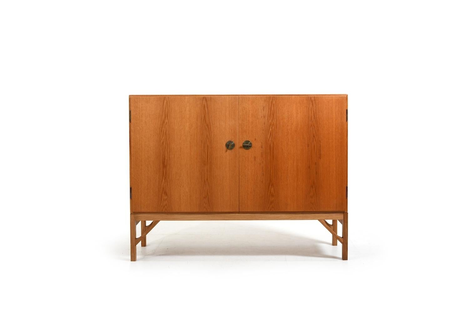 Sideboard / cabinet, model no.232 by Børge Mogensen for FDB Møbler Denmark. Brass handles. He designed his China Series in 1960s. Made in teak and base in oak. Produced 1960s.

Note. Please have a look on the matching cabinet with bookcase in our