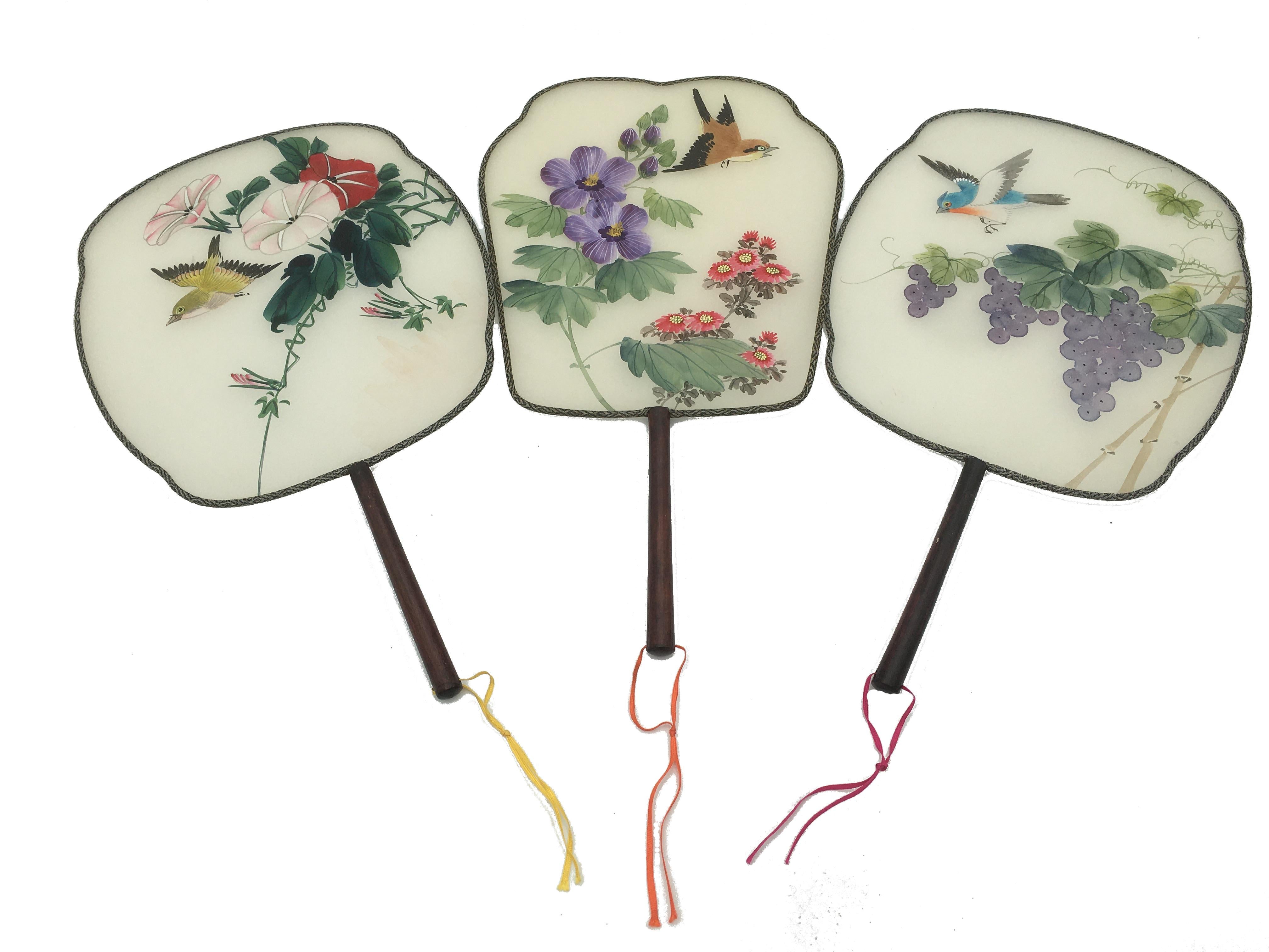 Set of 3 delicate silk hand painted rigid fans (Pay-Pay) from China with floral and birds decoration.
China
End of 19th beginning of the 20th century. 
Some tiny holes in the silk near the edge. 

 
 