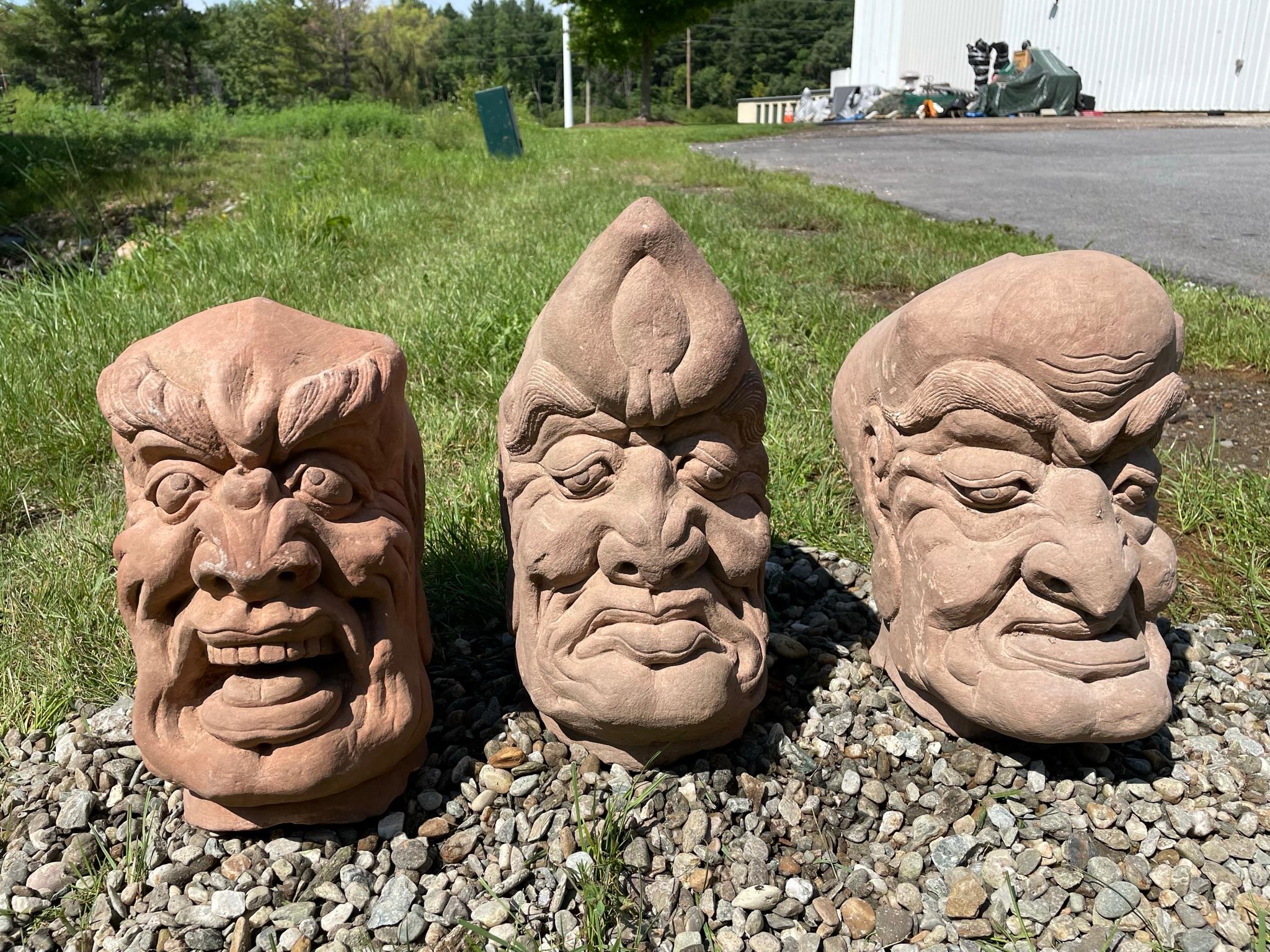 Instant display and collection, one of a kind.

From western China and collected some 20 years ago, comes this group of three (3) large hand carved red sandstone Lohans or Monks dating to the early 20th century. 

These characters feature