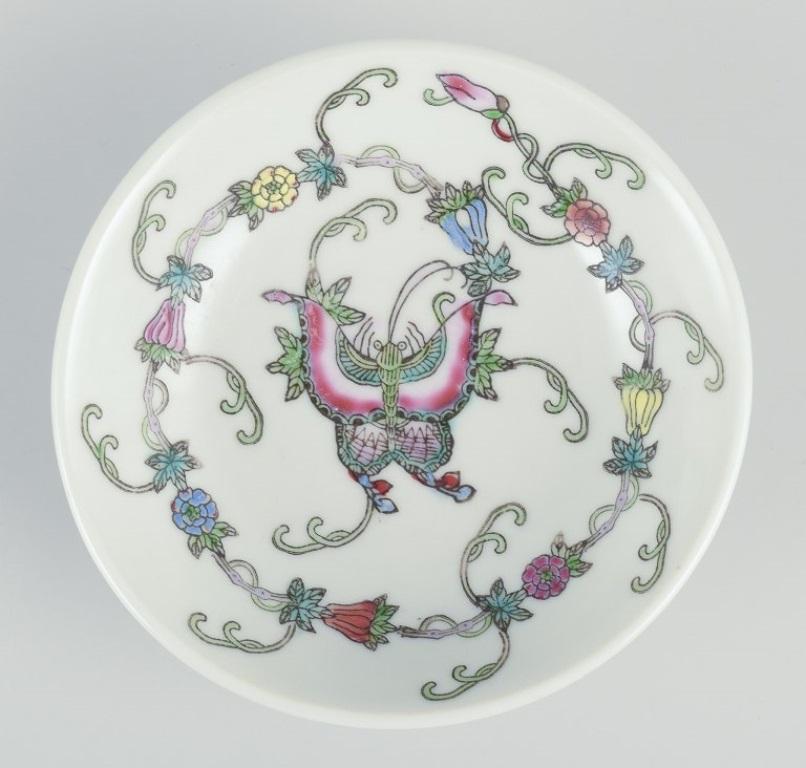 China, three porcelain bowls. 
Classic motifs with flowers and butterflies.
Hand-painted. 
1900s.
Marked.
Perfect condition.
Small: Diameter 10.0 cm. x Height 3.0 cm.
Large: Diameter 14.0 cm. x Height 3.0 cm.

