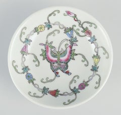 China, three porcelain bowls. Classic motifs with flowers and butterflies.