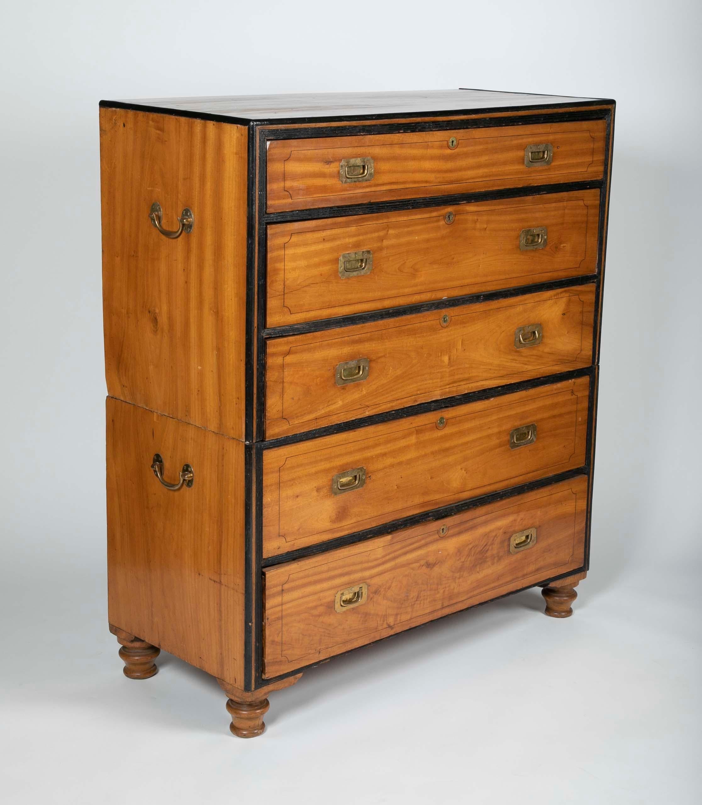 A large, China-trade, camphor wood campaign chest with secretary, circa 1860. It retains its original four brass bail carrying handles. The sides are made of single pieces of wood. The upper section contains a drop-down, pull-out secretary drawer