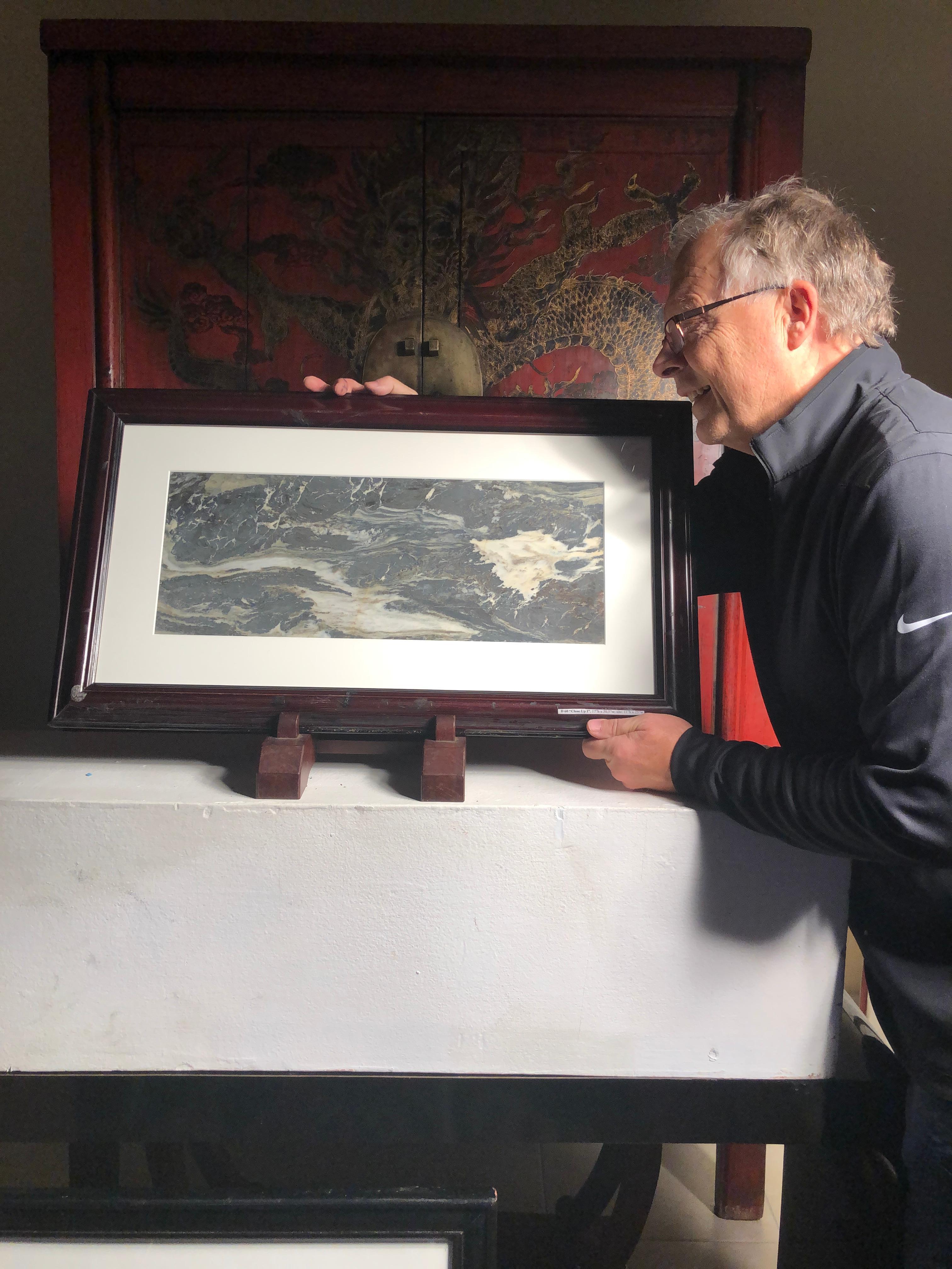 Extraordinary natural work, one of a kind. Custom framed

This Chinese extraordinary natural stone painting of churning sea waves among rocks could remind us of a unique shoreline or boating event in our lives. The powerful and colorful depiction
