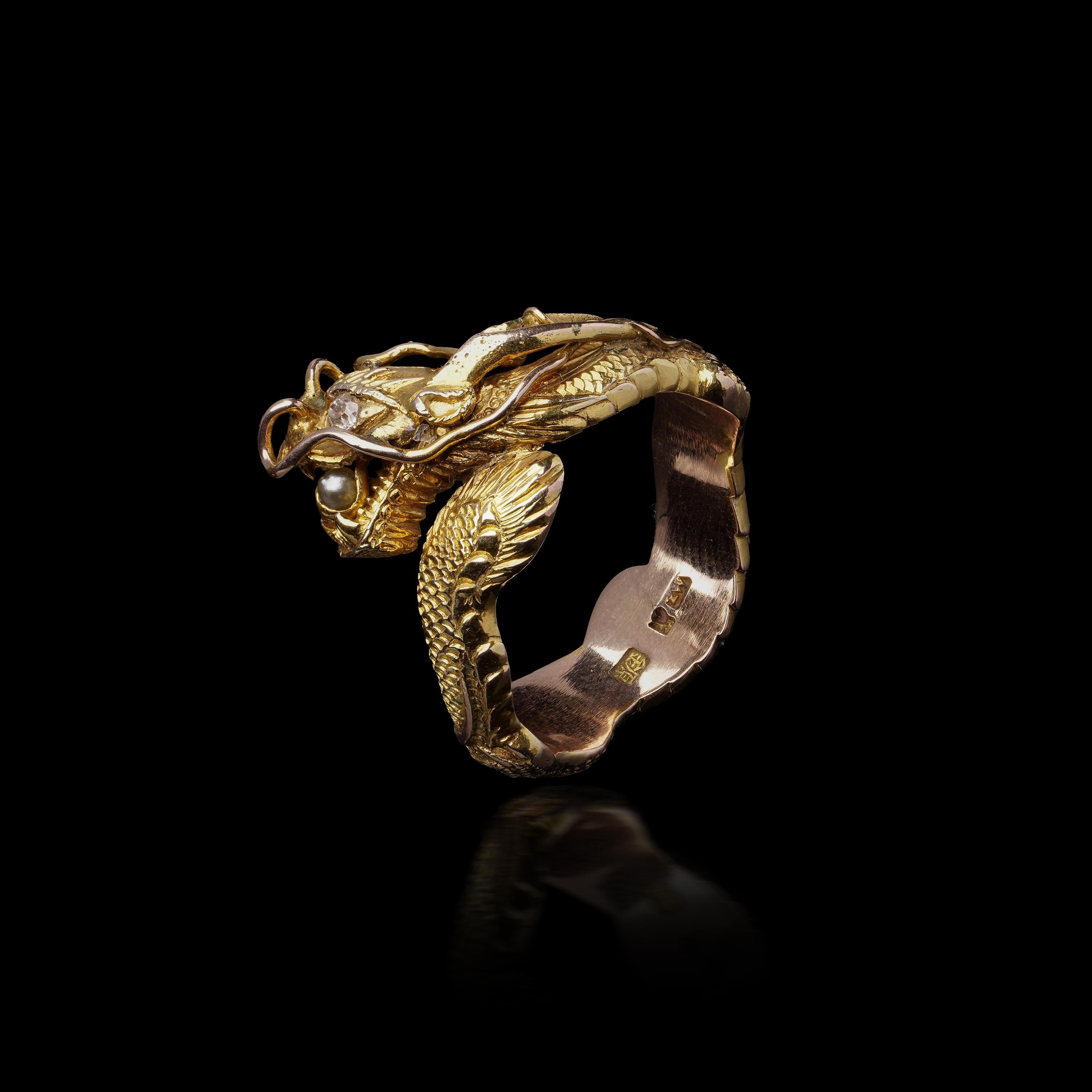 A bold statement of power and heritage, this vintage Chinese men’s ring is masterfully crafted in 14kt yellow gold and features an intricately detailed dragon wrapped around the band. The sculptural form captures the dragon mid-roar, its expressive