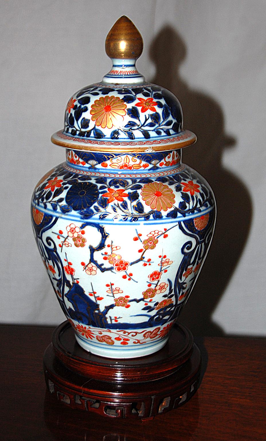Chinese 18th century pair of 12 inch Imari Temple Jars with original lids. In the first half of the 18th century the Chinese copied the imari patterns that were popular in Japan and exported them widely. The Chinese underglaze blue is much softer
