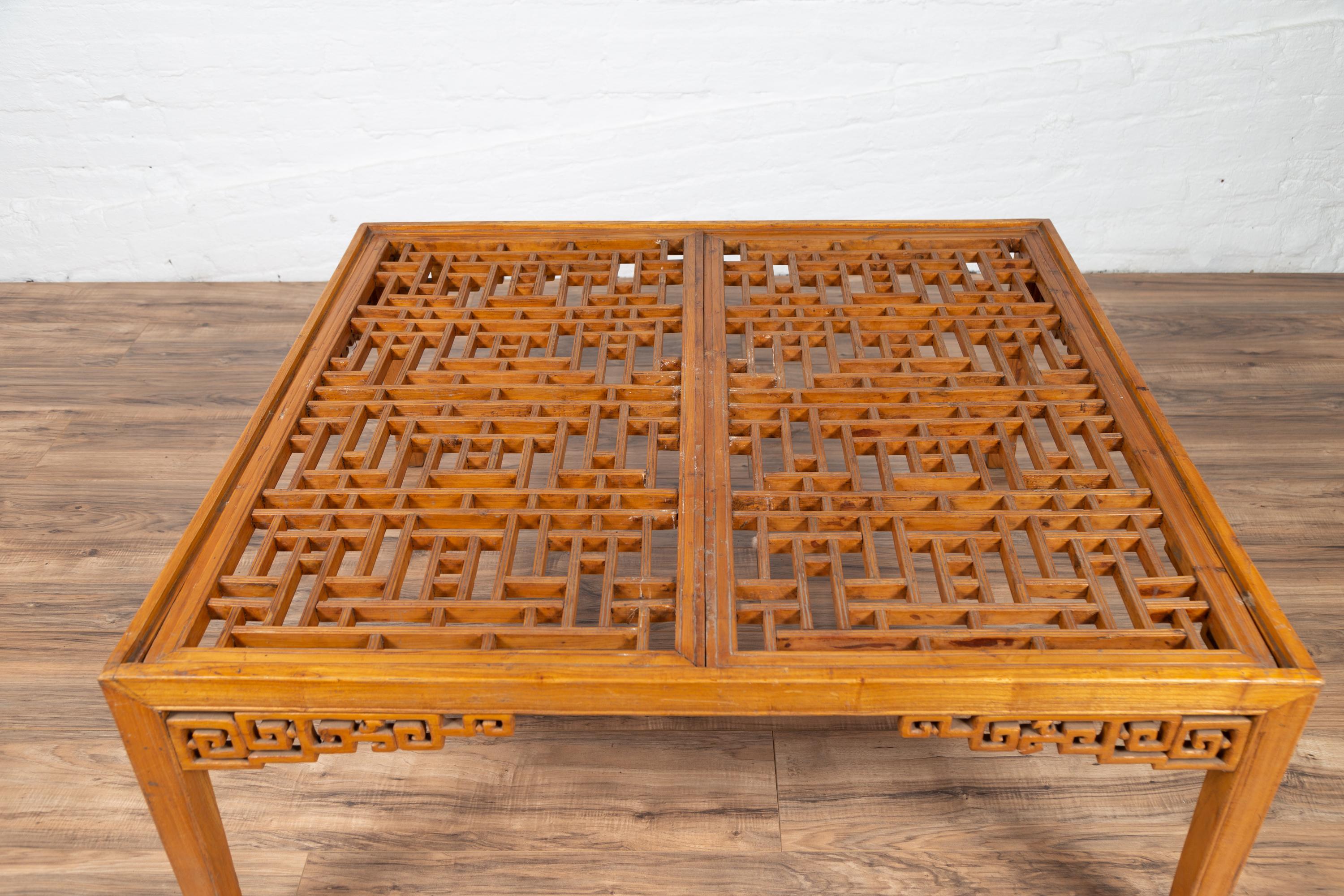 Chinese Elmwood Square Coffee Table with Open Fretwork and Horse-Hoof Legs In Good Condition For Sale In Yonkers, NY