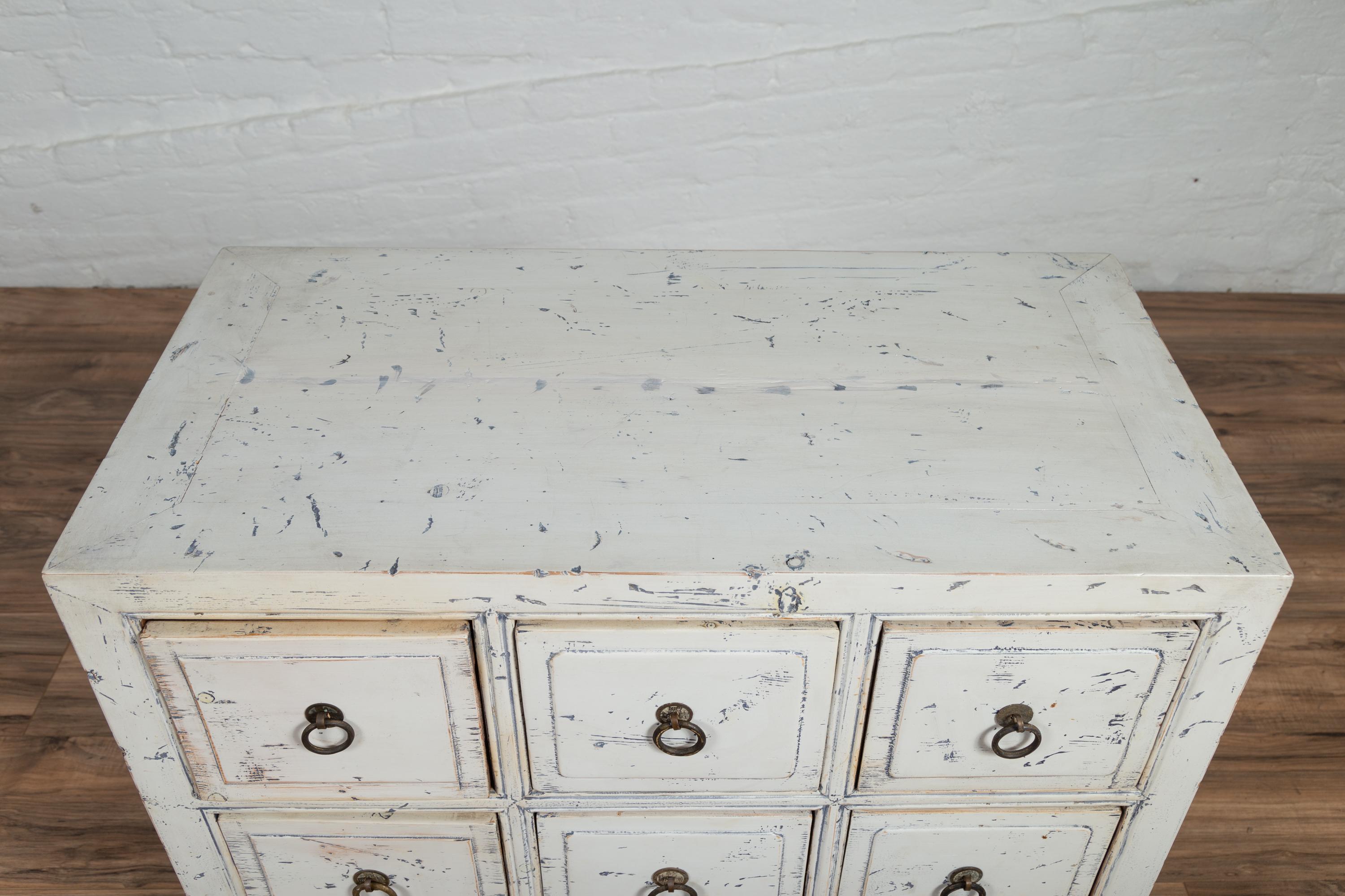 20th Century Chinese 1950s White Painted Nine-Drawer Apothecary Chest with Distressed Finish