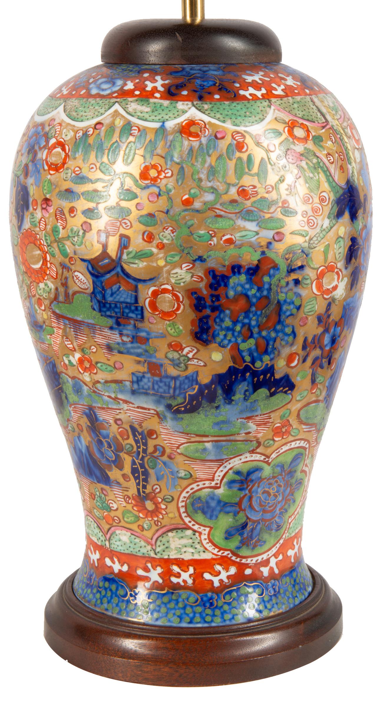 A very decorative 19th century Chinese blue and white later clobbered vase / lamp. Having wonderful bold coloring of flowers and classical motifs on the blue and white ground.