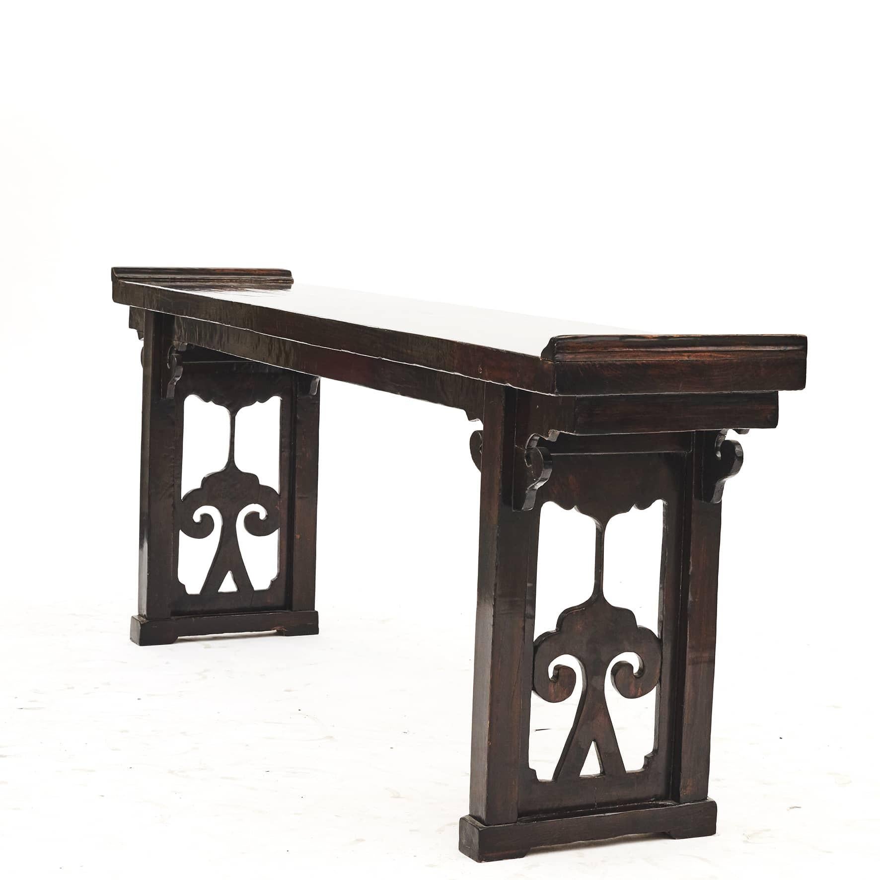 Chinese 19th Century Qing dynasty style altar console table.
Elm wood with remnants of the black lacquer.
The top is carved from a single solid plank. Side panels on the two 